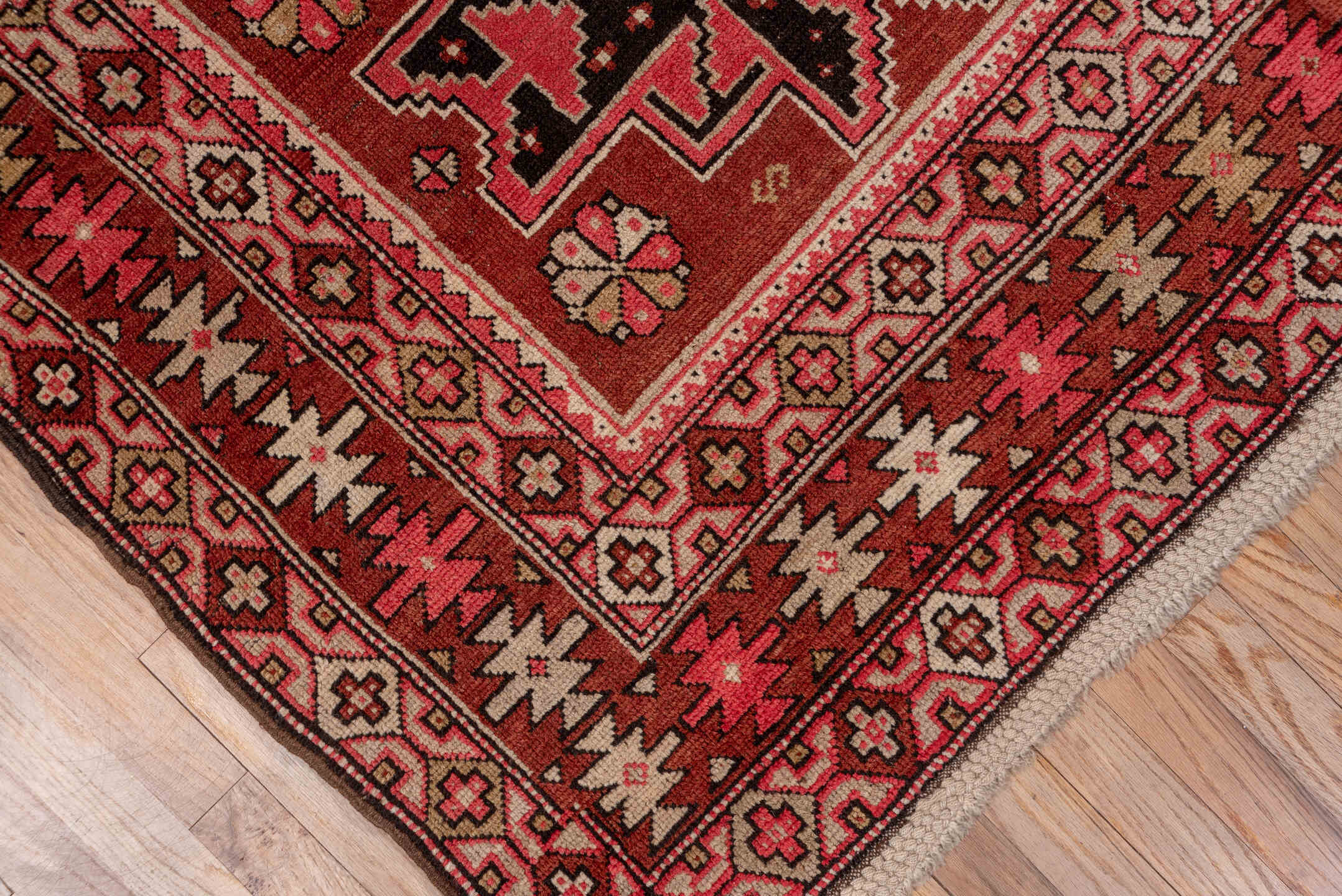 4' x 6' one-of-a-kind handmade vintage Shirvan small size rug. Color palette: brown, burgundy, indian red, pink, red