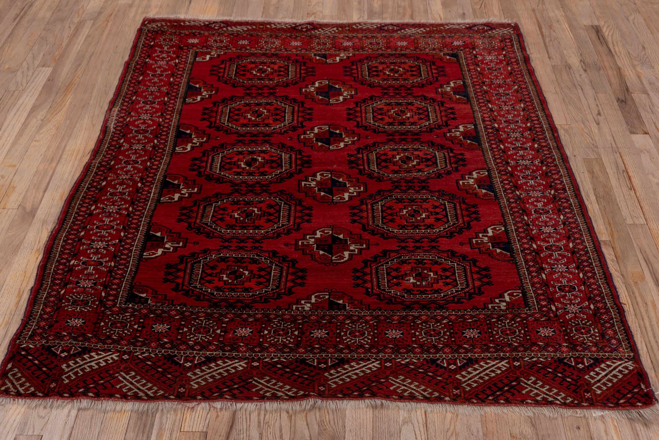 4' x 5' one-of-a-kind handmade antique Torkaman rug. Color palette: crimson, burgundy, rust, ivory, navy, charcoal, rose