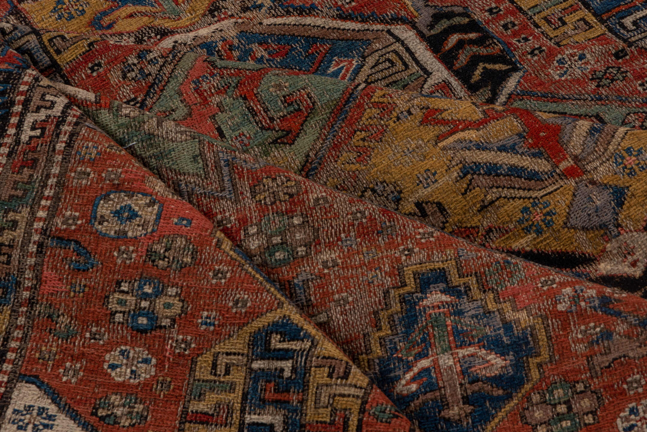 6' x 10' one-of-a-kind handmade antique Sumak large size rug. Color palette: rust, indigo, ivory, camel, aqua, charcoal