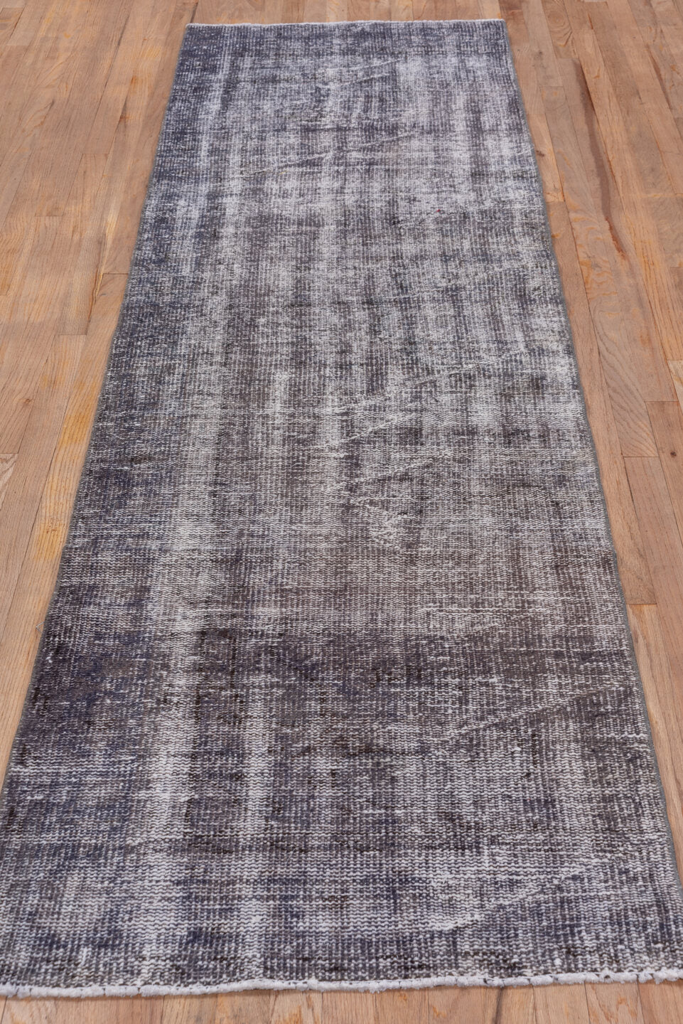 2' x 9' one-of-a-kind handmade vintage Overdyed runner rug. Color palette: black, gainsboro, gray, light gray, off-white