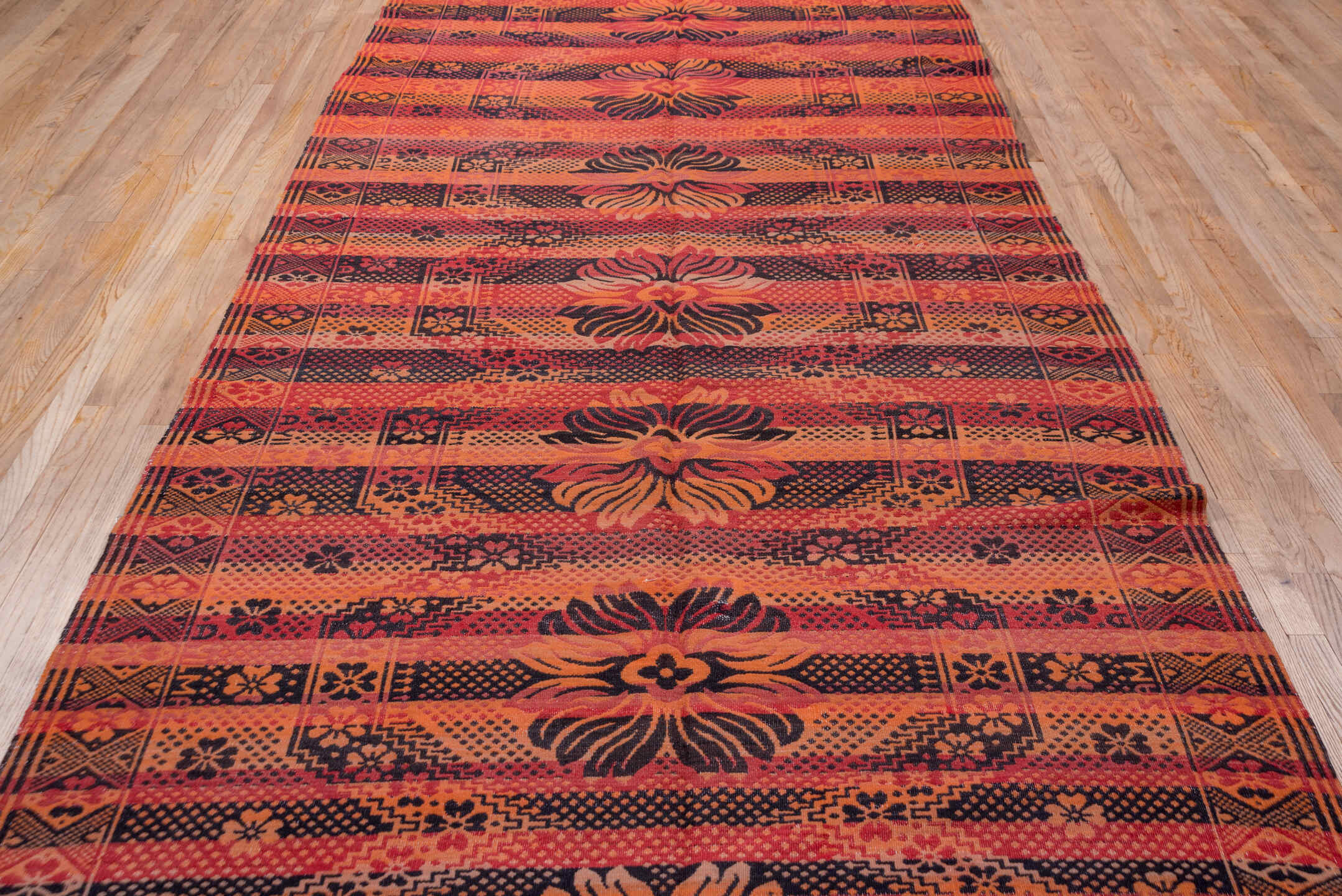 5' x 11' one-of-a-kind handmade antique Kilim rug. Color palette: terra cotta, rust, coral, mahogany, burgundy, rose