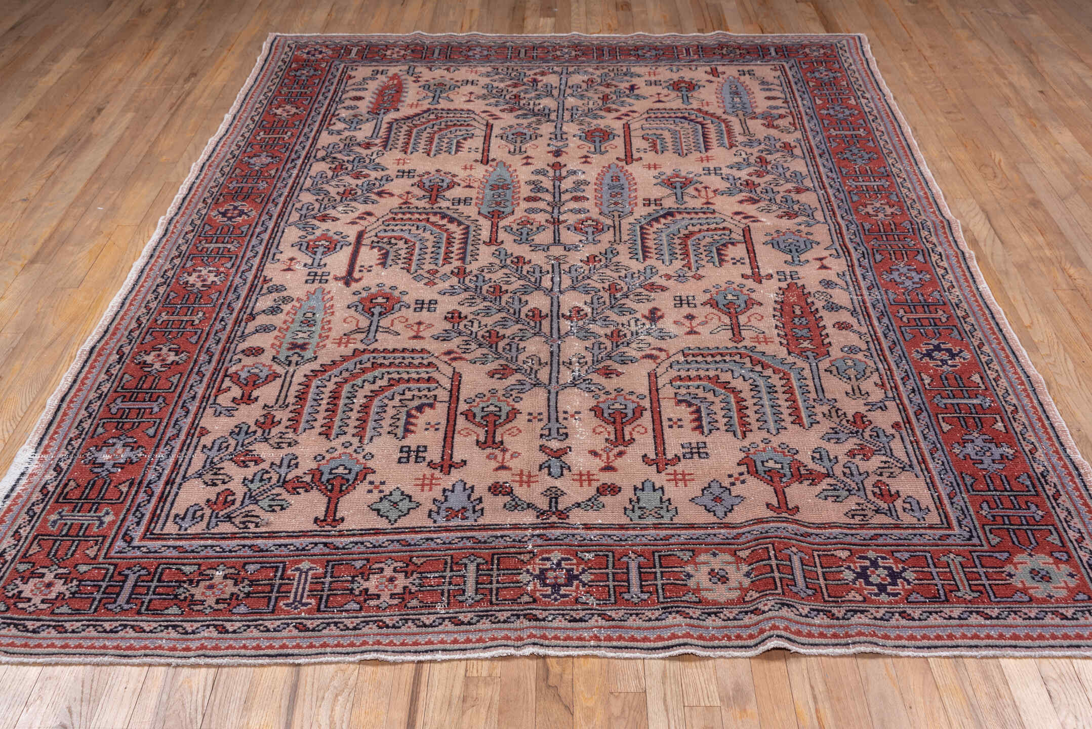 7' x 9' one-of-a-kind handmade antique Oushak rug. Color palette: ivory, rust, slate, charcoal, rose, crimson, terracotta