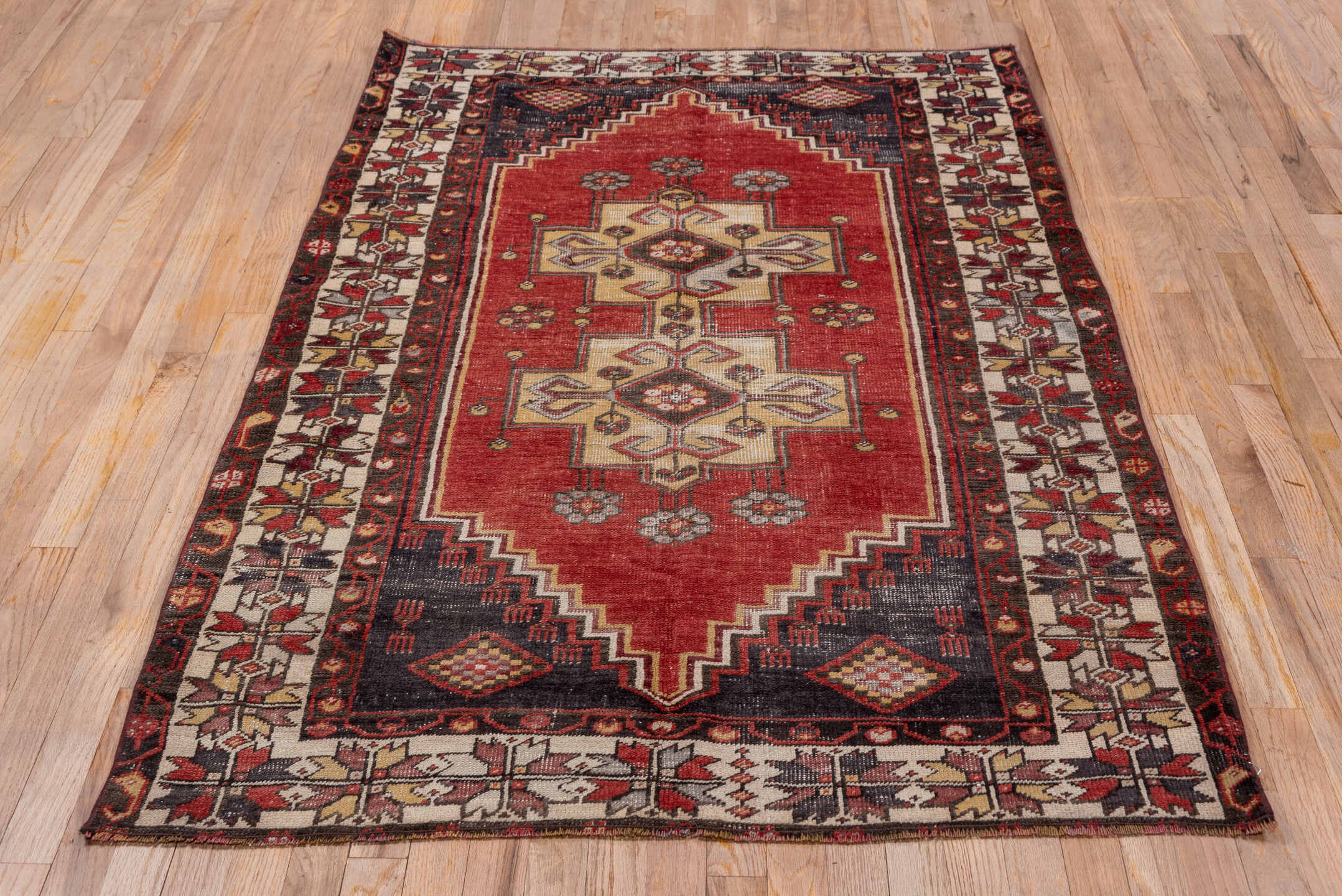 4' x 6' one-of-a-kind handmade antique Oushak small size rug. Color palette: rust, ivory, indigo, burgundy, taupe, camel