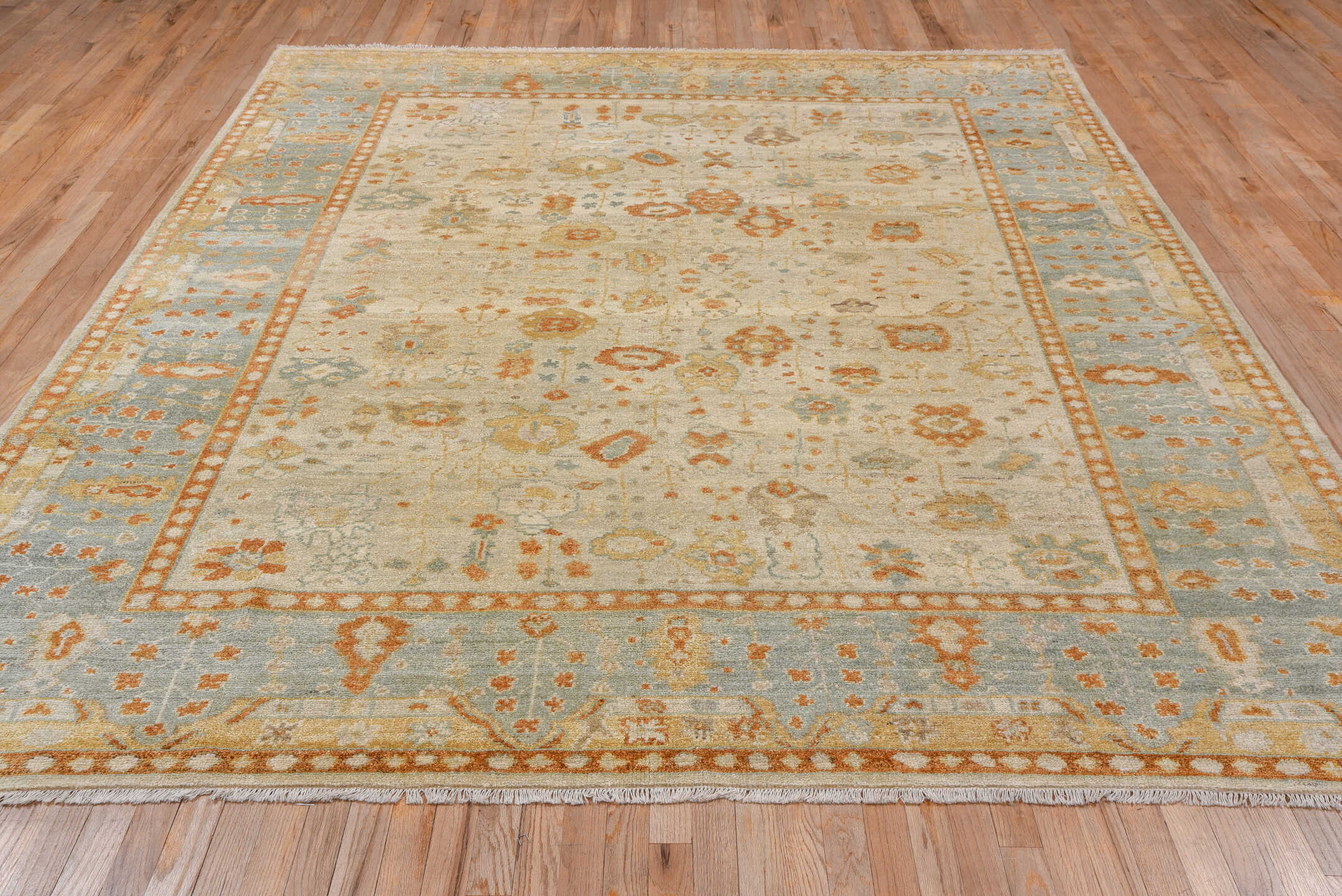 8' x 9' one-of-a-kind handmade vintage Oushak rug. Color palette: ivory, pale blue, gold, sand, taupe, terra cotta