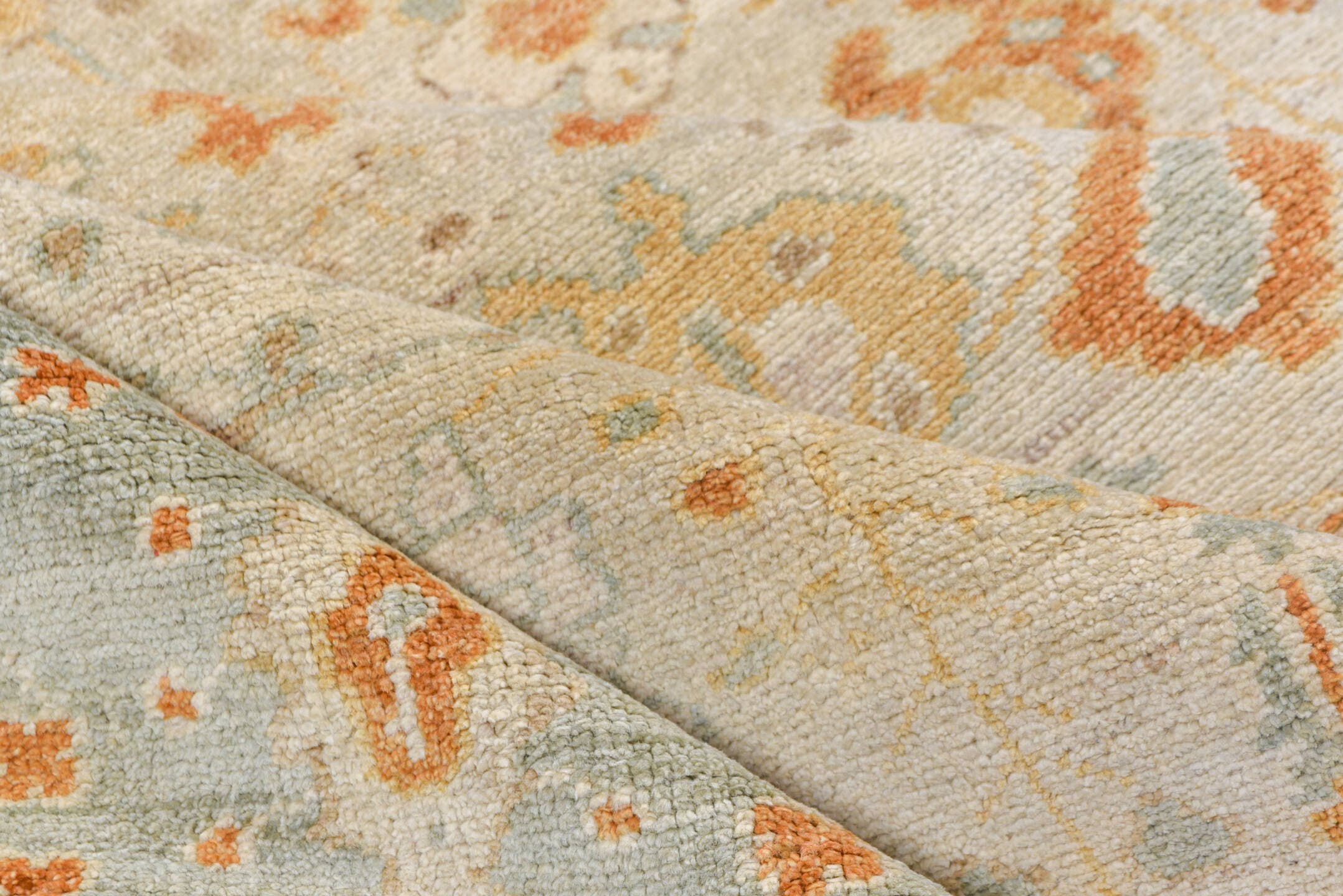 8' x 9' one-of-a-kind handmade vintage Oushak rug. Color palette: ivory, pale blue, gold, sand, taupe, terra cotta