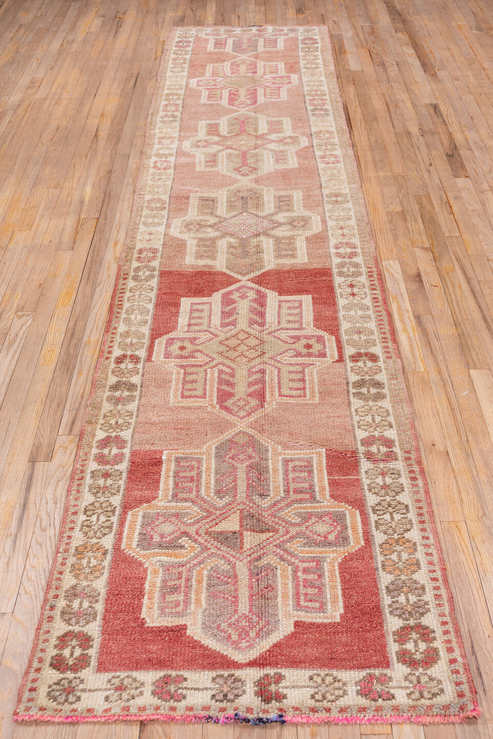 2' x 12' one-of-a-kind handmade vintage Oushak runner rug. Color palette: rose, ivory, blush, taupe, terra cotta, pink, red