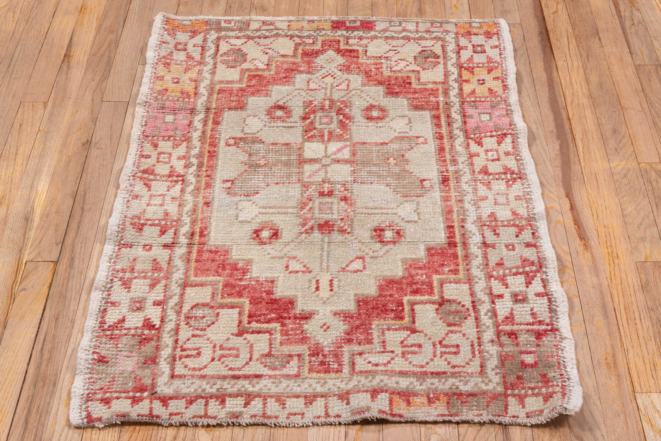 2' x 4' one-of-a-kind handmade vintage Oushak small size rug. Color palette: ivory, coral, rose, taupe, peach, camel