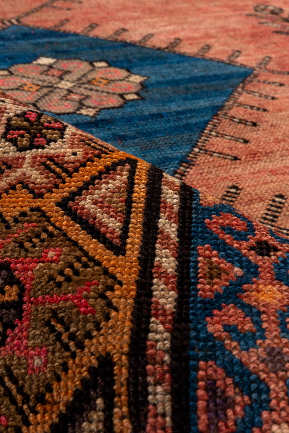 4' x 12' one-of-a-kind handmade vintage Oushak runner rug. Color palette: terra cotta, rust, navy, ivory, rose, camel