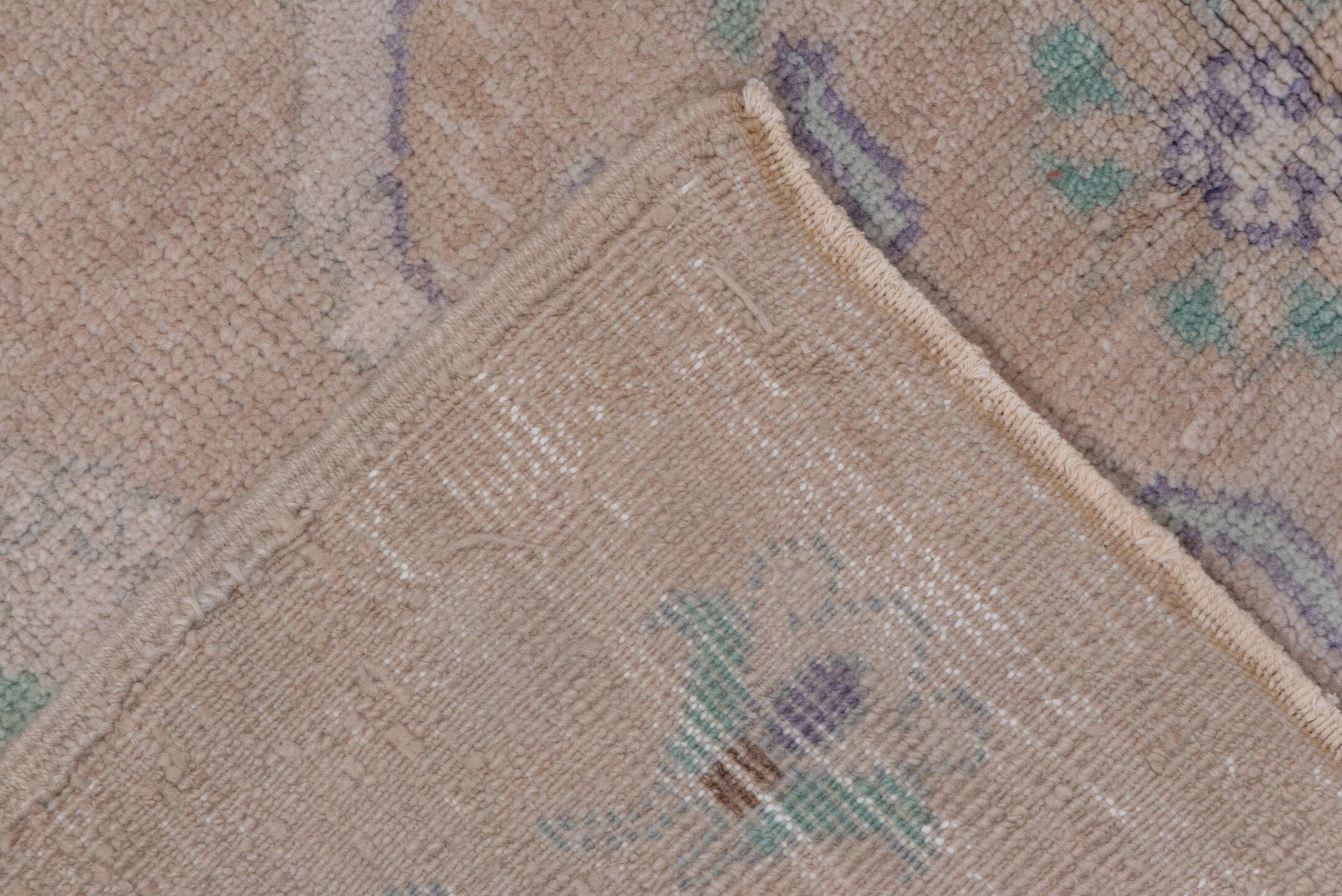 4' x 7' one-of-a-kind handmade vintage Oushak rug. Color palette: blush, ivory, mint, lavender, taupe, sage, pink, green