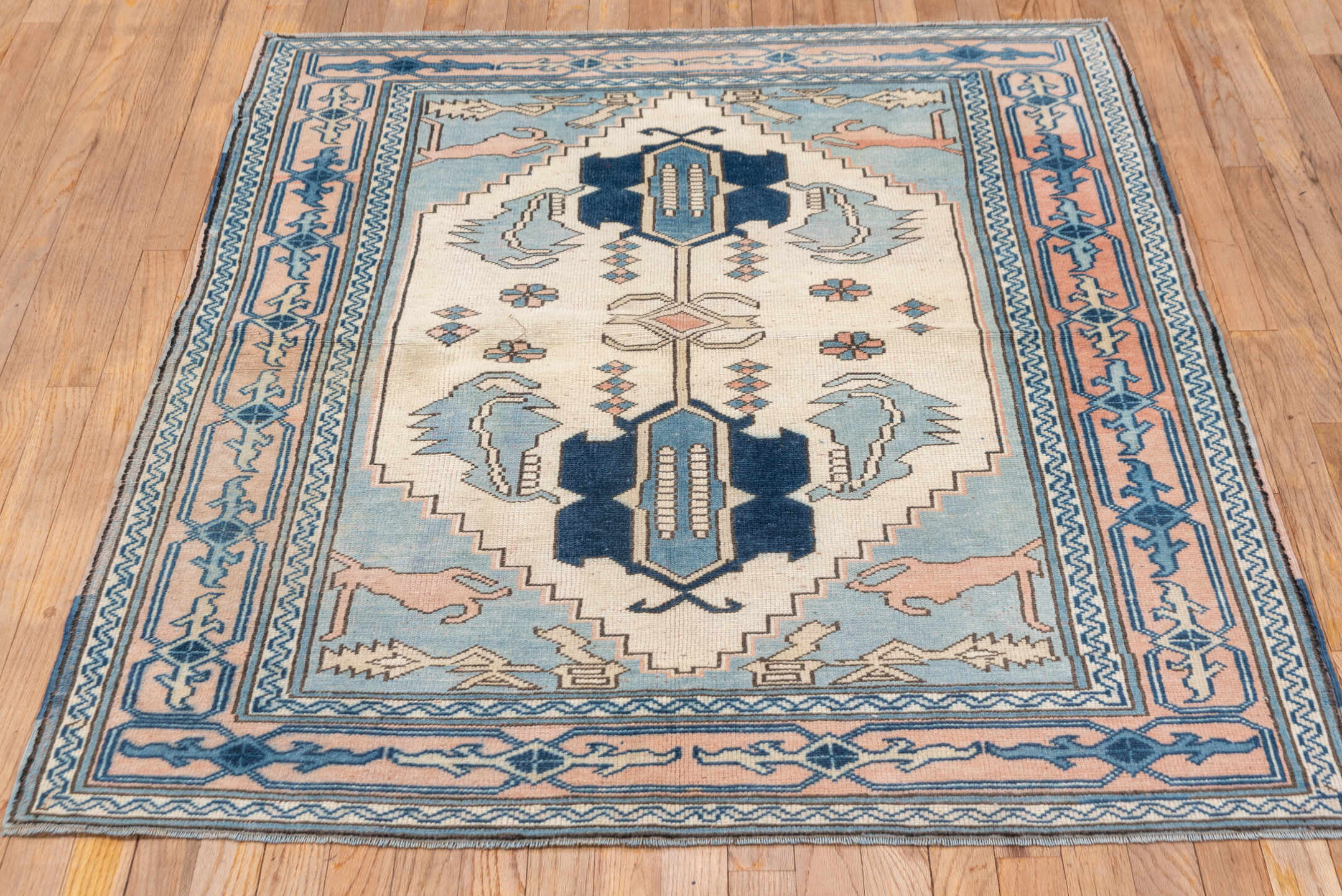 4' x 5' one-of-a-kind handmade vintage Oushak small size rug. Color palette: ivory, sky blue, blush, navy, taupe, light blue