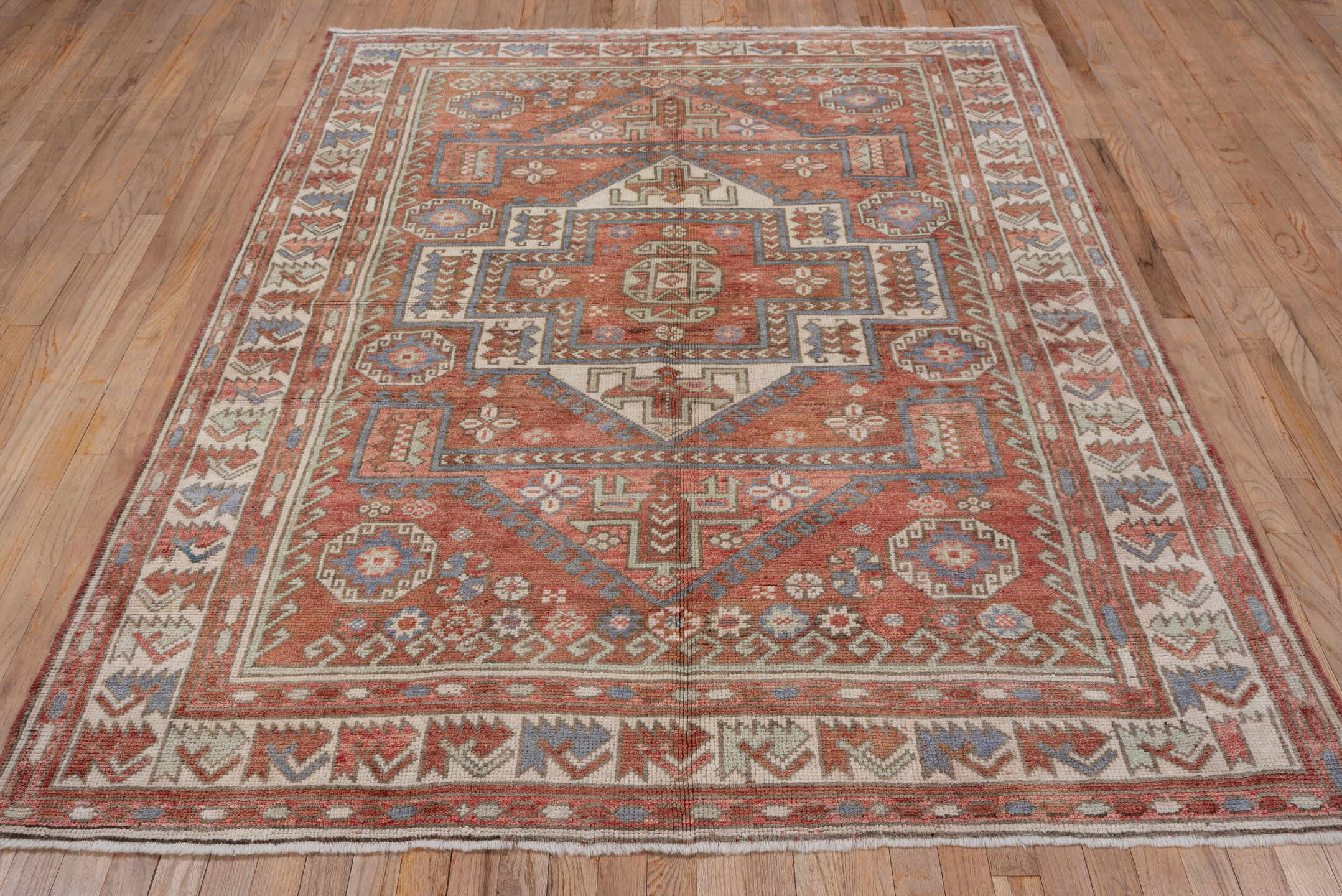 5' x 8' one-of-a-kind handmade vintage Oushak medium size rug. Color palette: terra cotta, ivory, dusty blue, rust, taupe