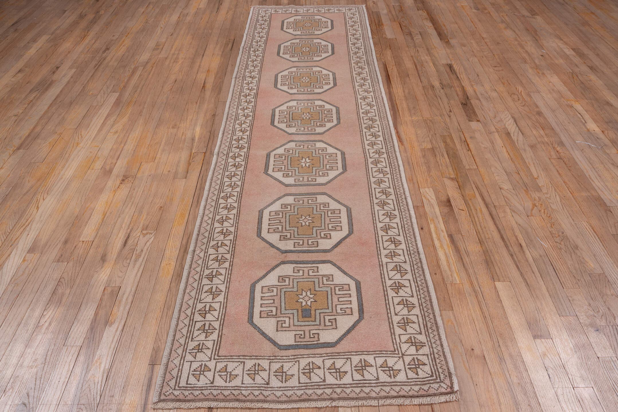 2' x 11' one-of-a-kind handmade vintage Oushak runner rug. Color palette: blush, ivory, taupe, camel, beige, soft gold, pink