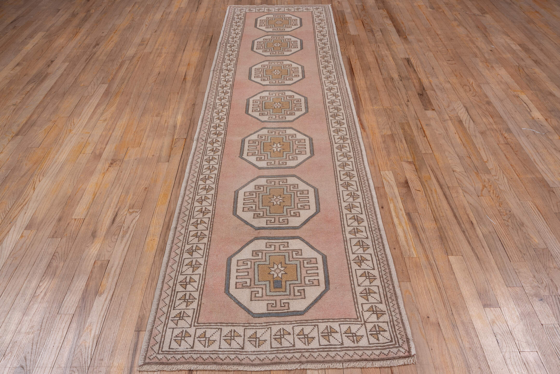 2' x 11' one-of-a-kind handmade vintage Oushak runner rug. Color palette: blush, ivory, taupe, camel, beige, soft gold, pink