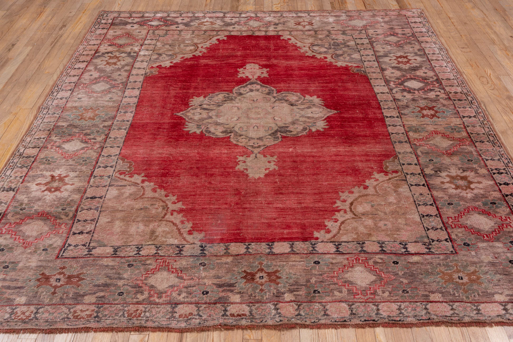 7' x 8' one-of-a-kind handmade antique Oushak rug. Color palette: coral, taupe, rose, ivory, sage, rust, charcoal