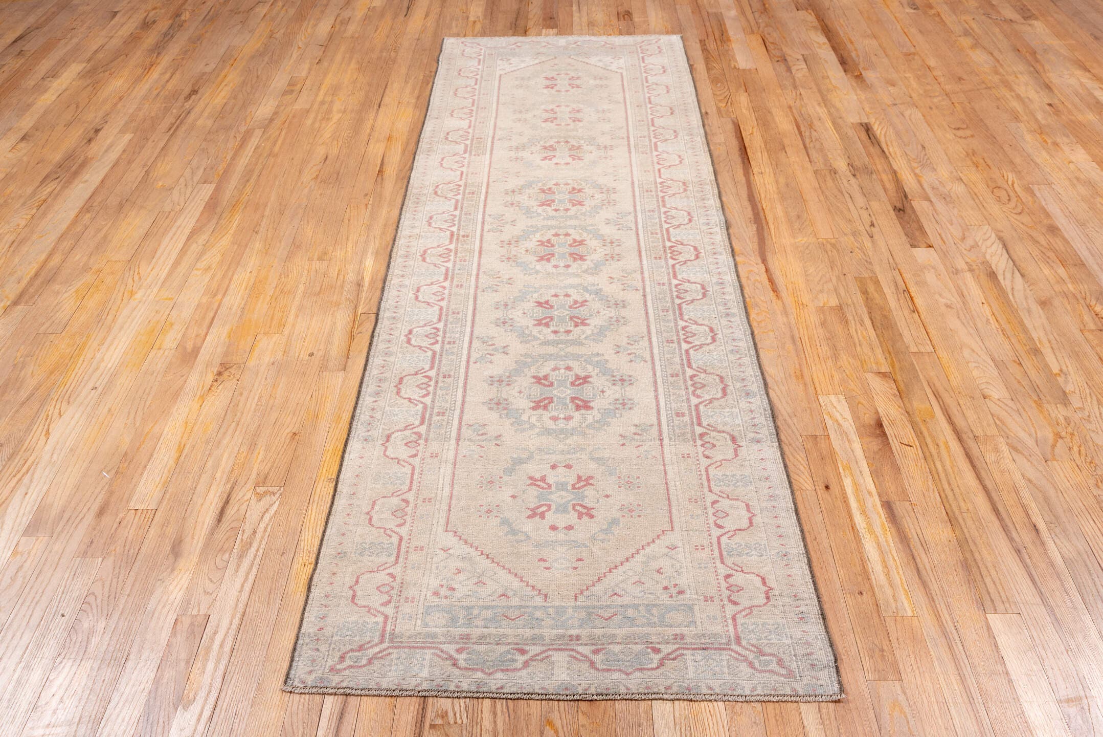 2' x 9' one-of-a-kind handmade vintage Oushak runner rug. Color palette: ivory, blush, pale blue, cream, taupe, rose, pink