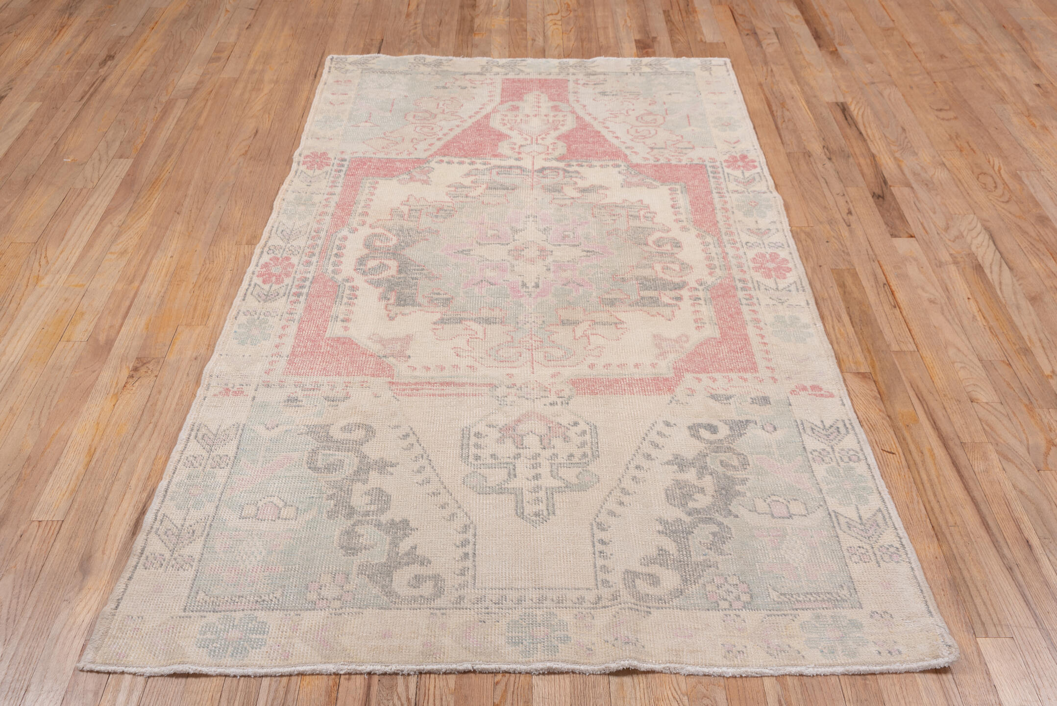 4' x 7' one-of-a-kind handmade vintage Oushak rug. Color palette: brown, gray, light gray, off-white, orange, pink, snow