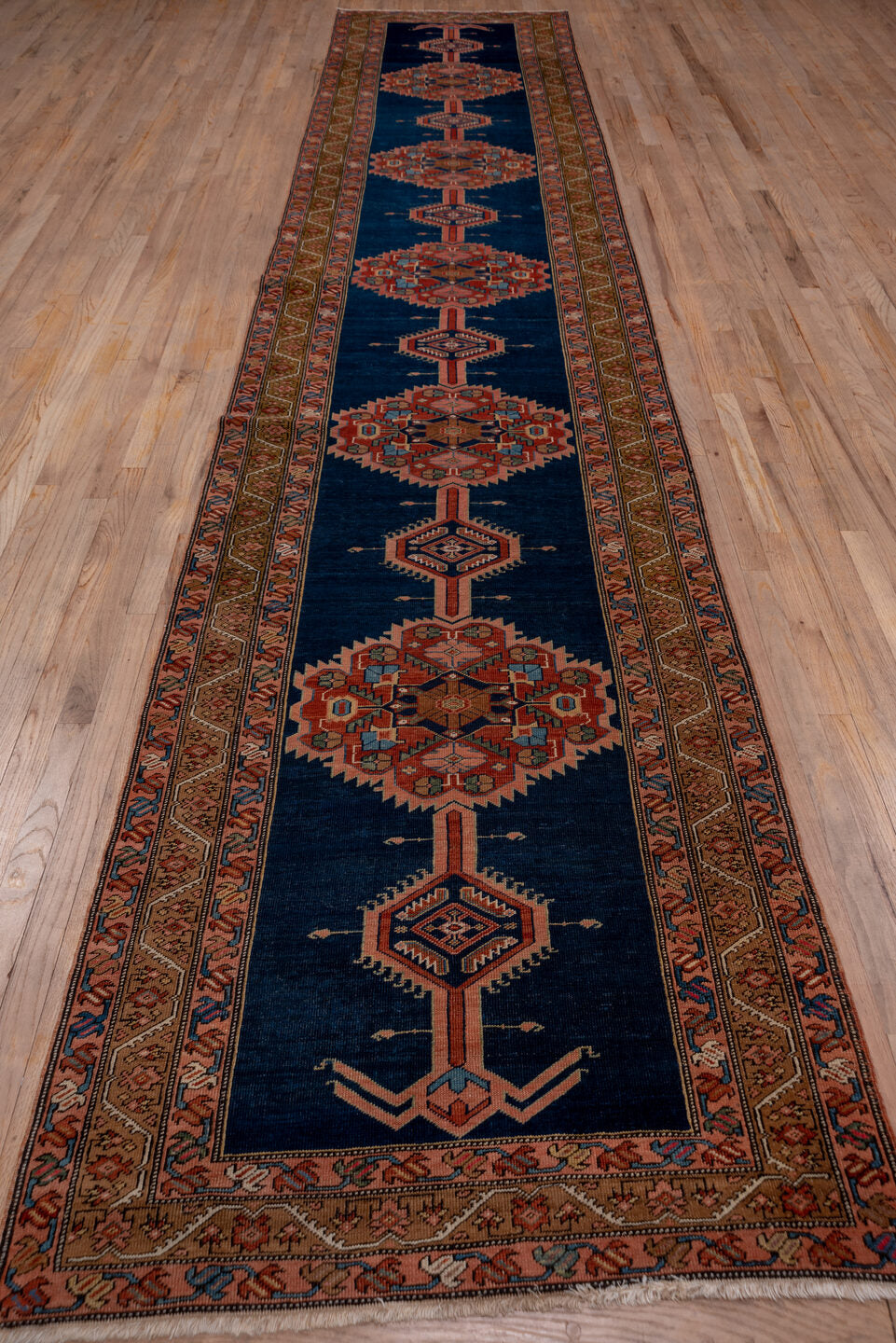 3' x 17' one-of-a-kind handmade antique Serapi runner rug. Color palette: navy, rust, camel, ivory, terra cotta, sage