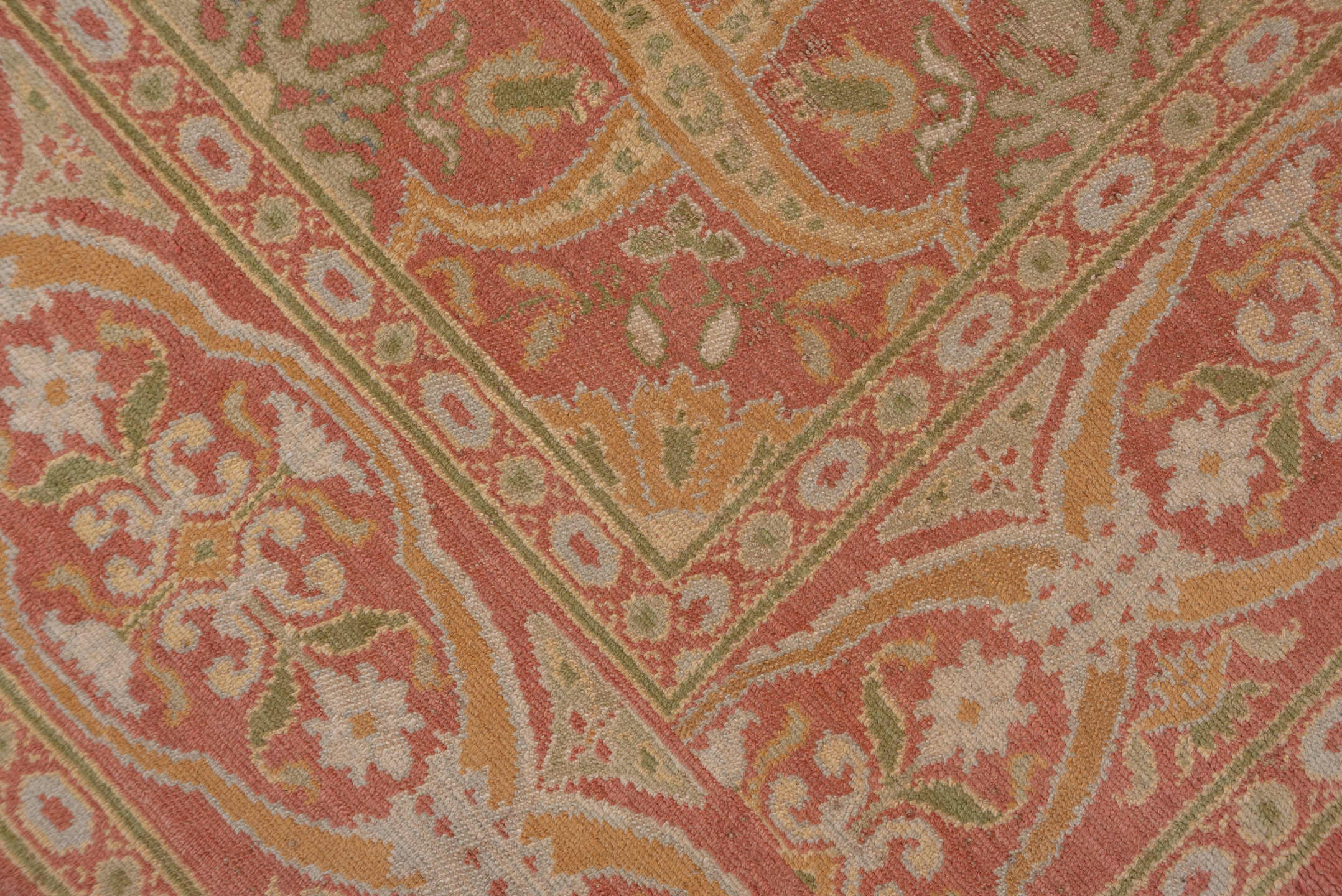 10' x 20' one-of-a-kind handmade antique Spanish rug. Color palette: coral, ivory, gold, sage, terra cotta, terracotta
