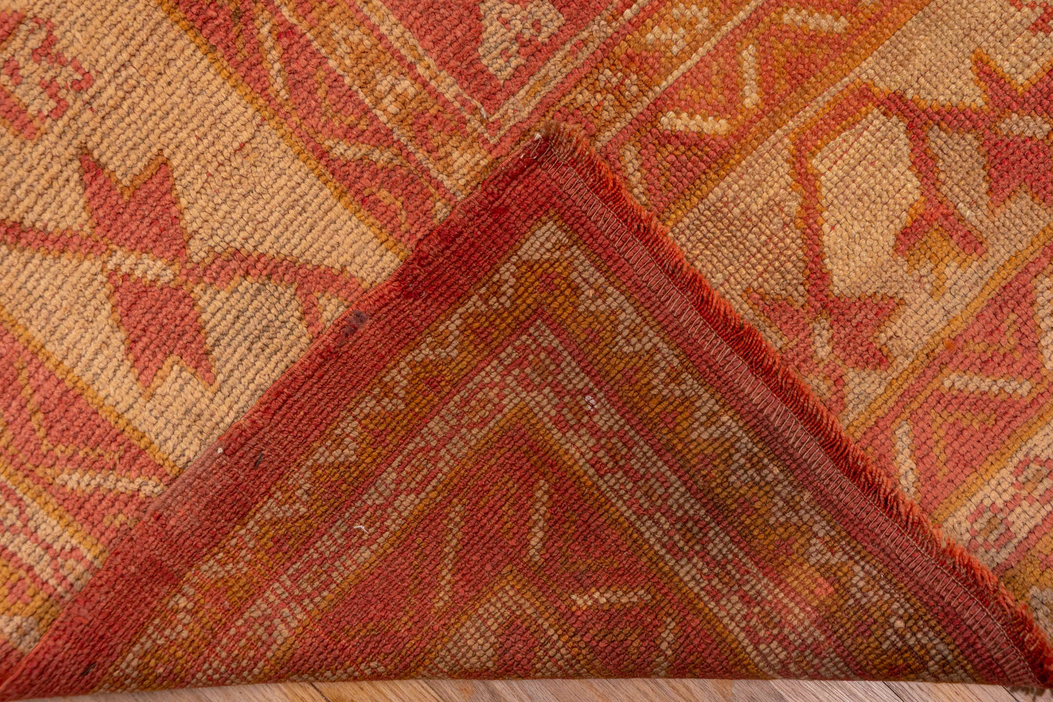 13' x 17' one-of-a-kind handmade vintage Oushak oversize rug. Color palette: brown, burlywood, dark salmon, orange, pink