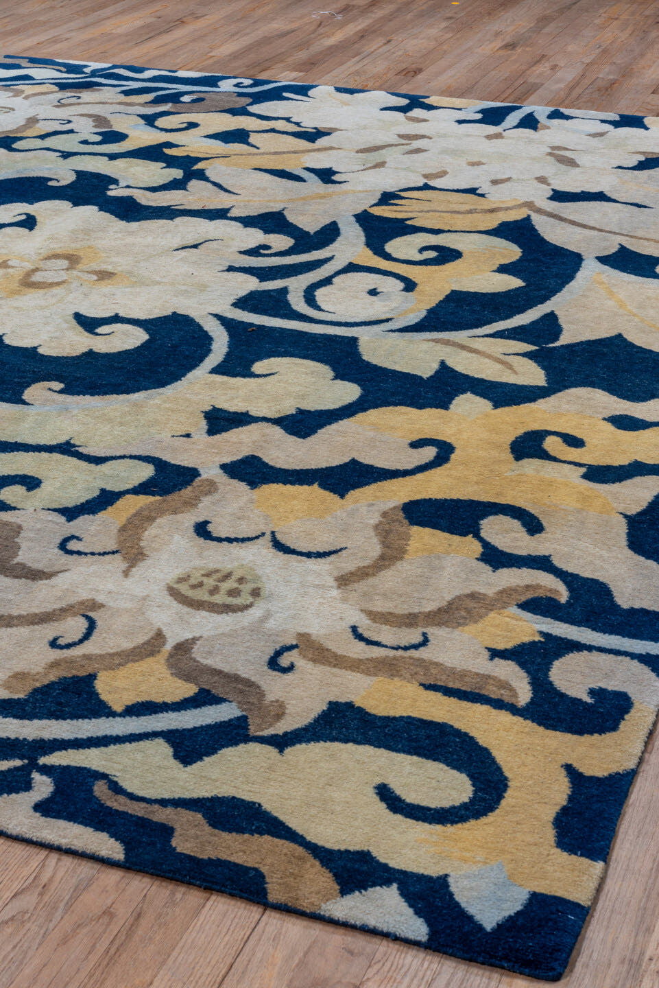 8' x 9' one-of-a-kind handmade vintage Tibetan rug. Color palette: navy, ivory, cream, taupe, slate, gold, blue, beige, gray