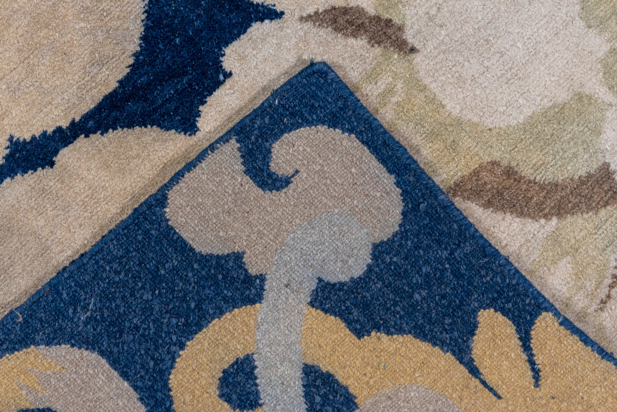 8' x 9' one-of-a-kind handmade vintage Tibetan rug. Color palette: navy, ivory, cream, taupe, slate, gold, blue, beige, gray