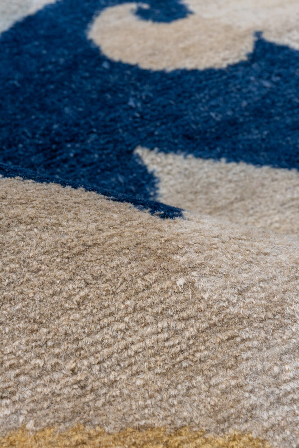8' x 9' one-of-a-kind handmade vintage Tibetan rug. Color palette: navy, ivory, cream, taupe, slate, gold, blue, beige, gray