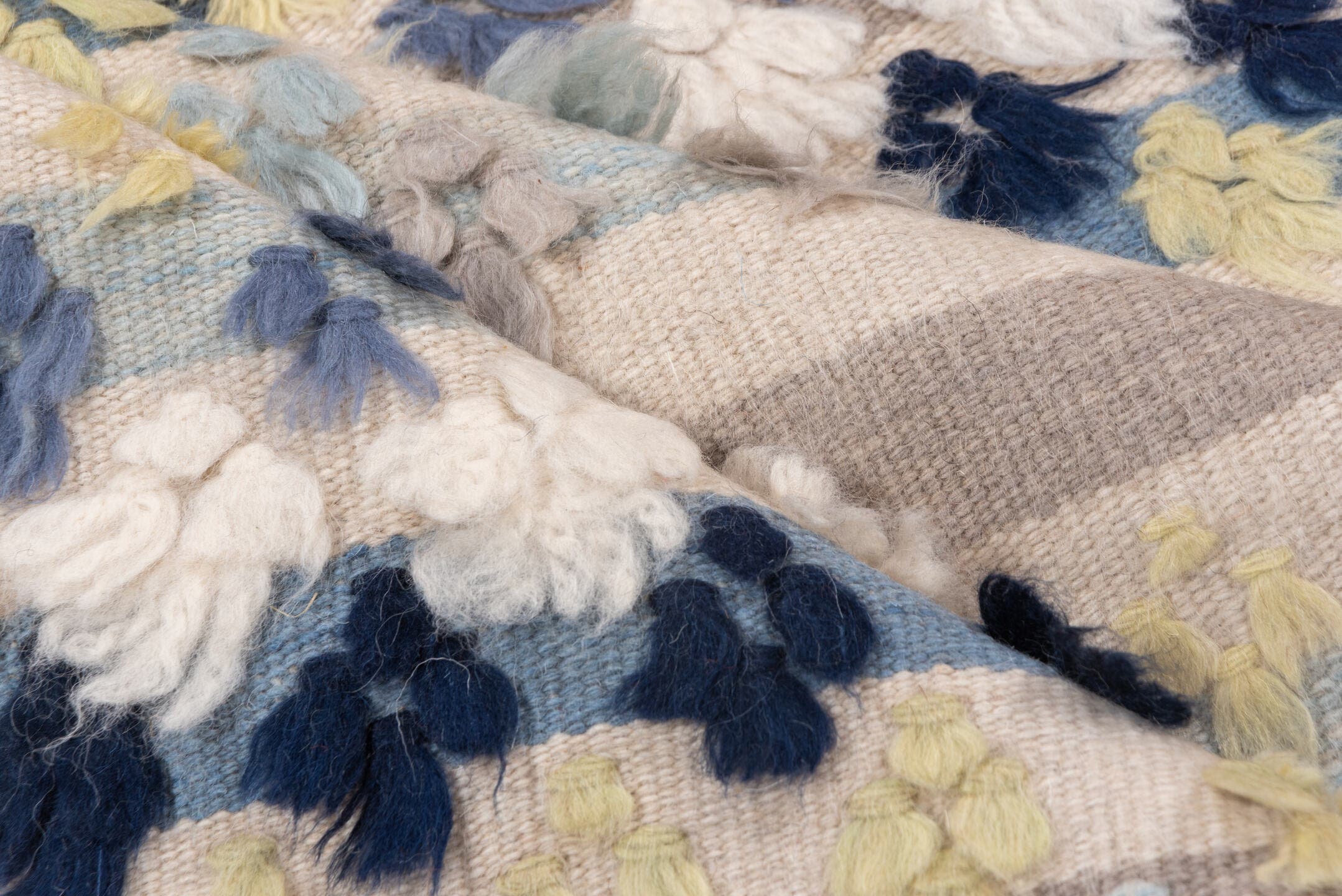 3' x 6' one-of-a-kind handmade vintage Tulu small size rug. Color palette: ivory, pale blue, taupe, navy, butter yellow