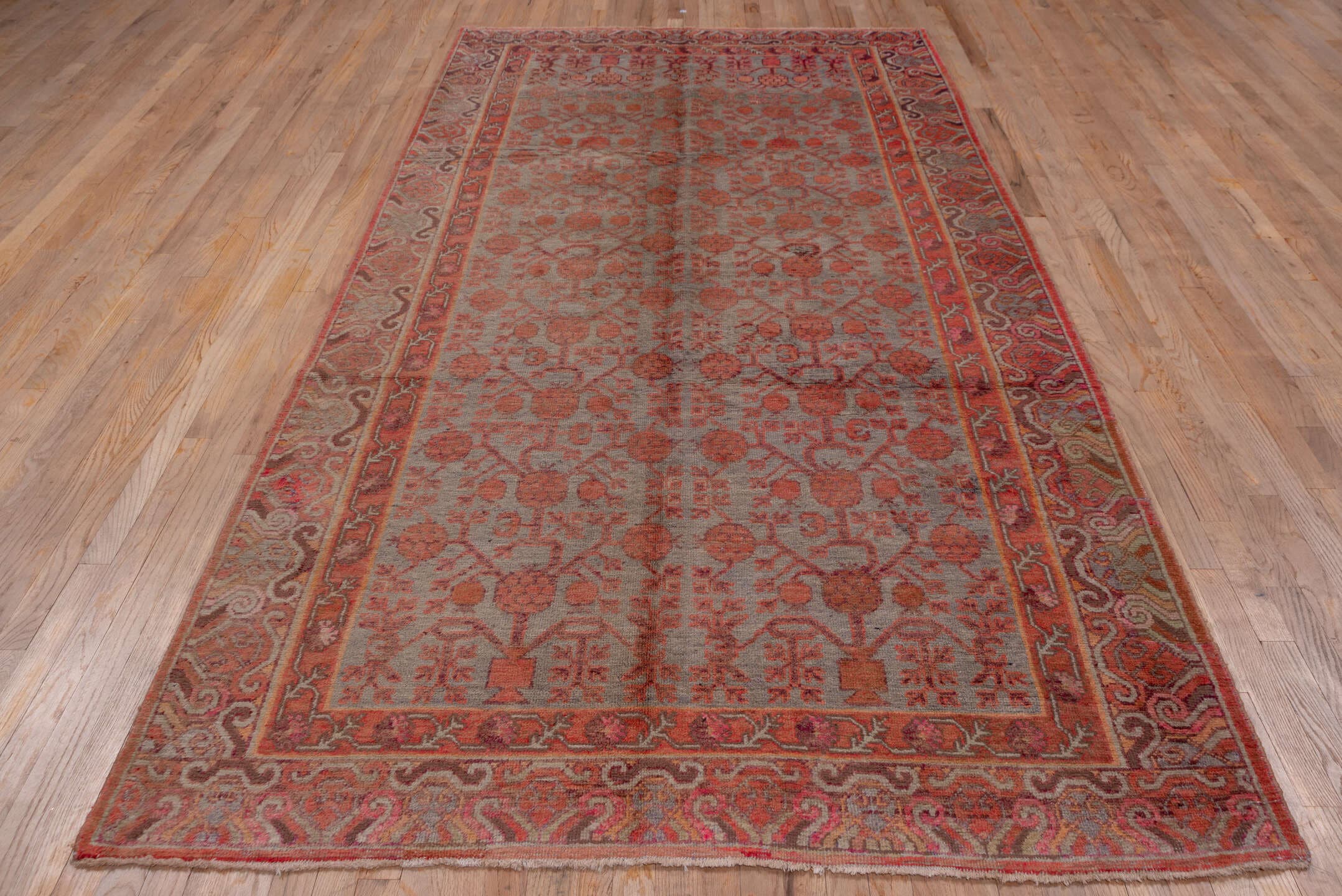 5' x 10' one-of-a-kind handmade vintage Khotan medium size rug. Color palette: rose, rust, taupe, terra cotta, dusty blue