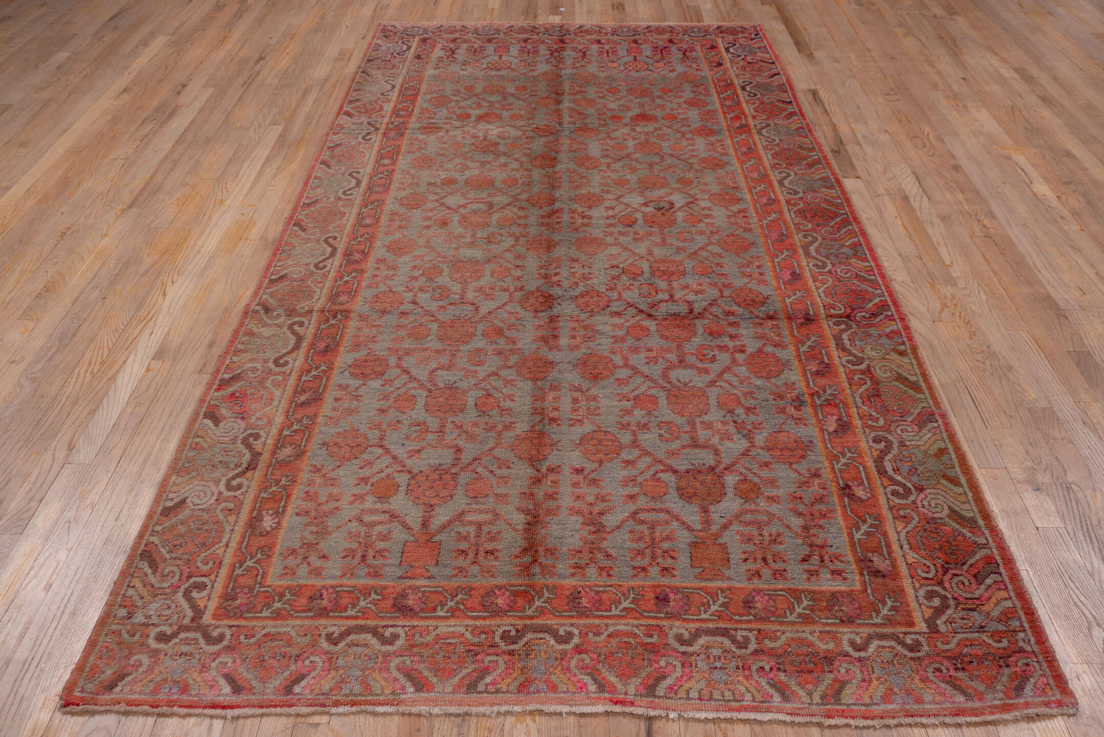 5' x 10' one-of-a-kind handmade vintage Khotan medium size rug. Color palette: rose, rust, taupe, terra cotta, dusty blue
