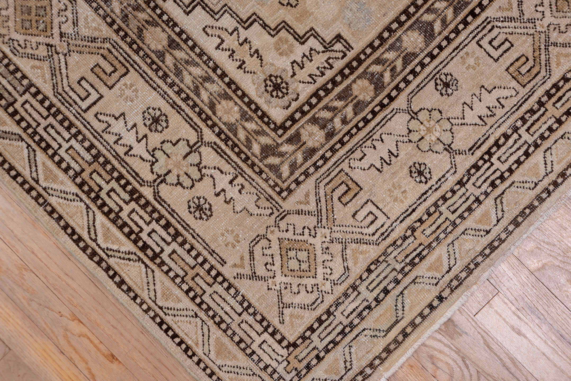 5' x 11' one-of-a-kind handmade vintage Khotan rug. Color palette: brown, gray, light gray, off-white, pink