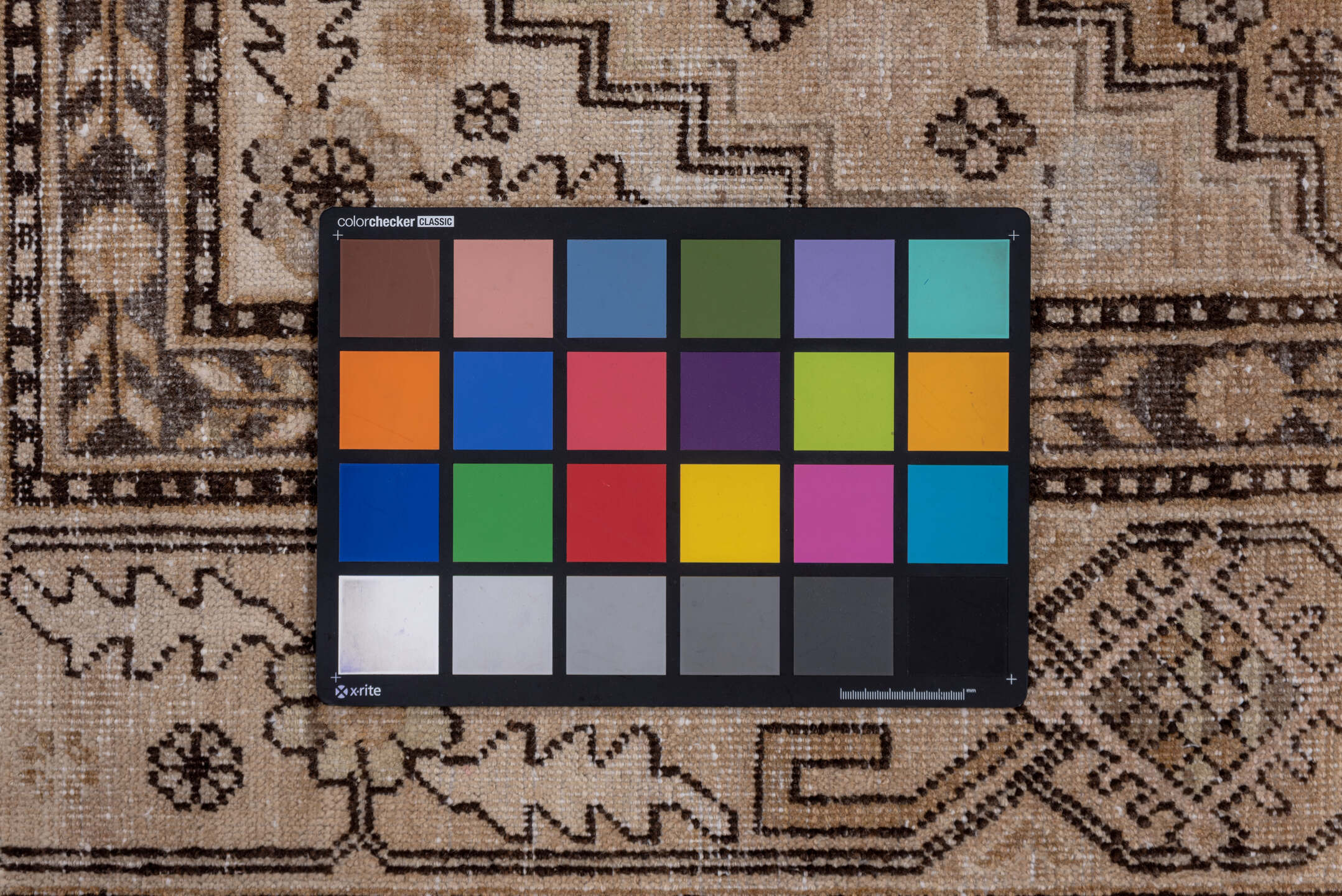 5' x 11' one-of-a-kind handmade vintage Khotan rug. Color palette: brown, gray, light gray, off-white, pink