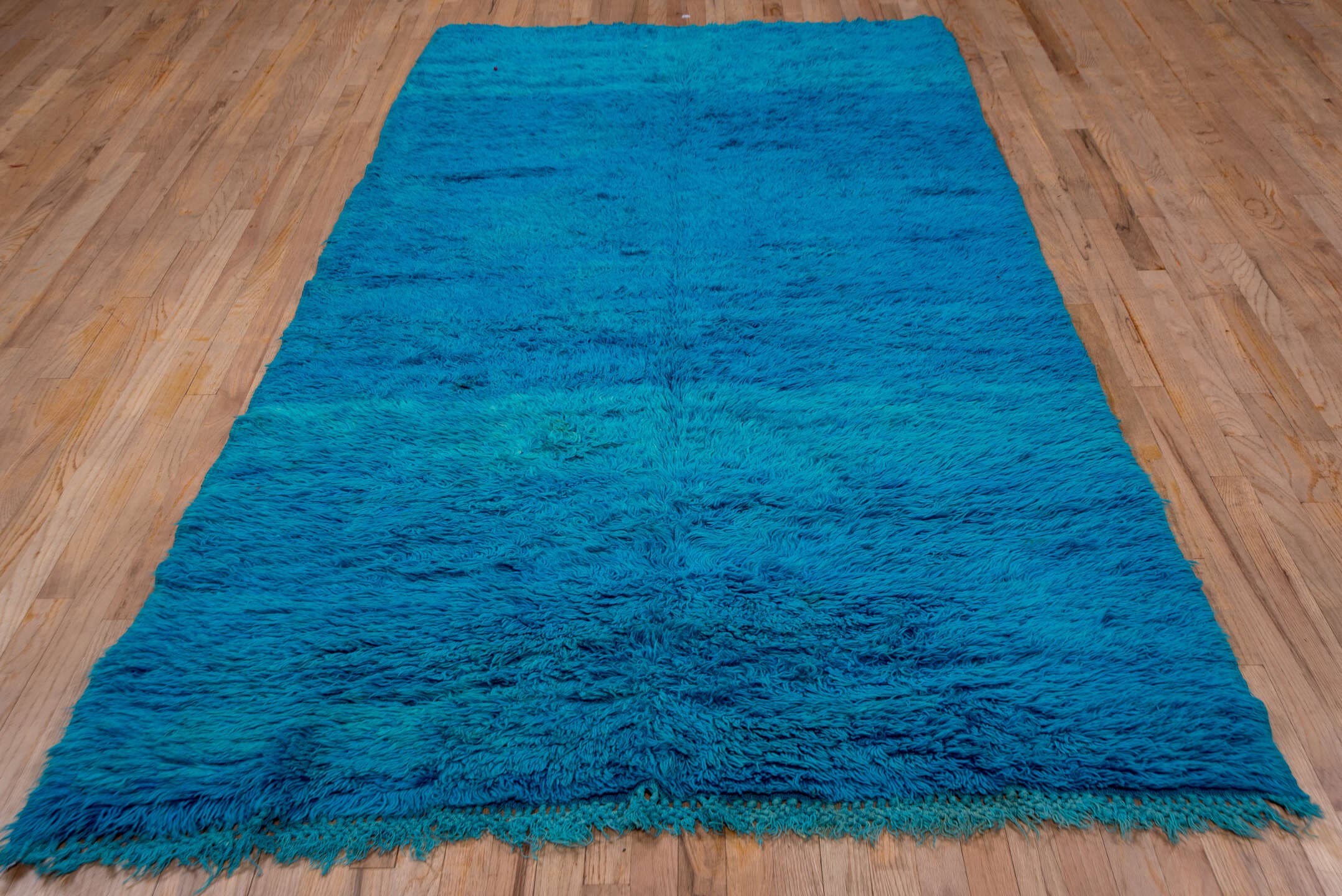 5' x 9' one-of-a-kind handmade vintage Moroccan medium size rug. Color palette: turquoise, teal, cobalt, blue