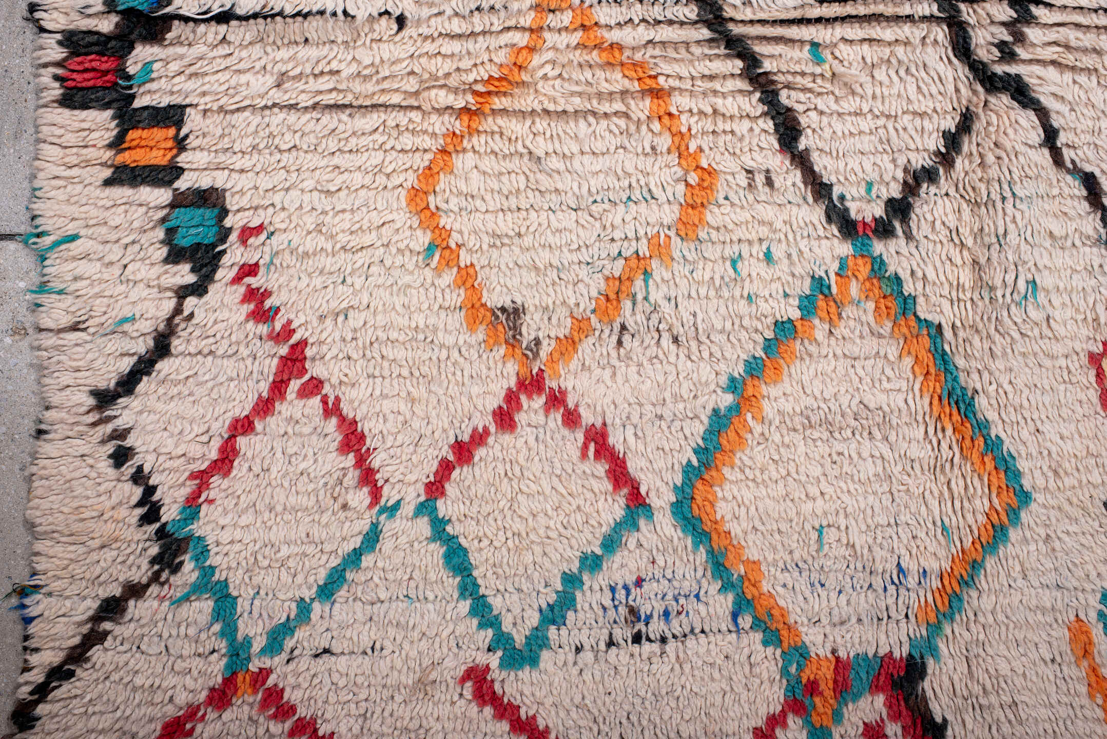 4' x 6' one-of-a-kind handmade vintage Moroccan small size rug. Color palette: ivory, turquoise, charcoal, orange, red, blue