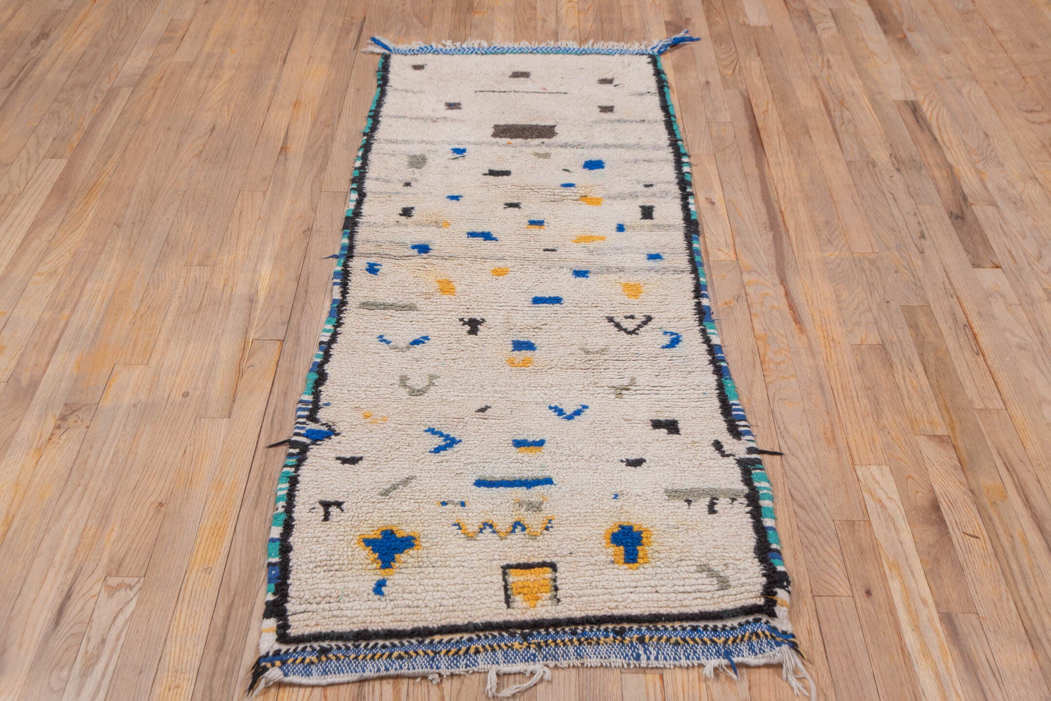 2' x 6' one-of-a-kind handmade vintage Moroccan runner rug. Color palette: ivory, charcoal, cobalt, gray, saffron, teal