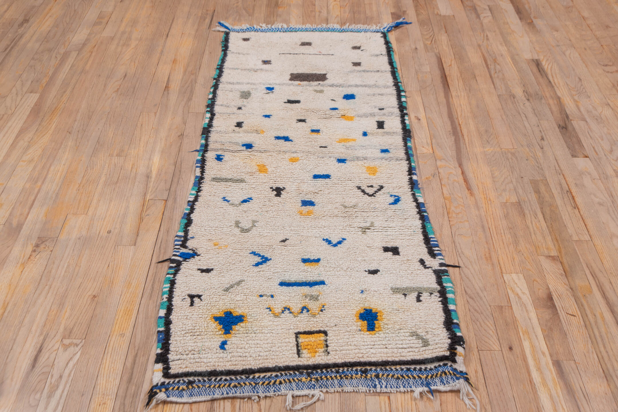 2' x 6' one-of-a-kind handmade vintage Moroccan runner rug. Color palette: ivory, charcoal, cobalt, gray, saffron, teal