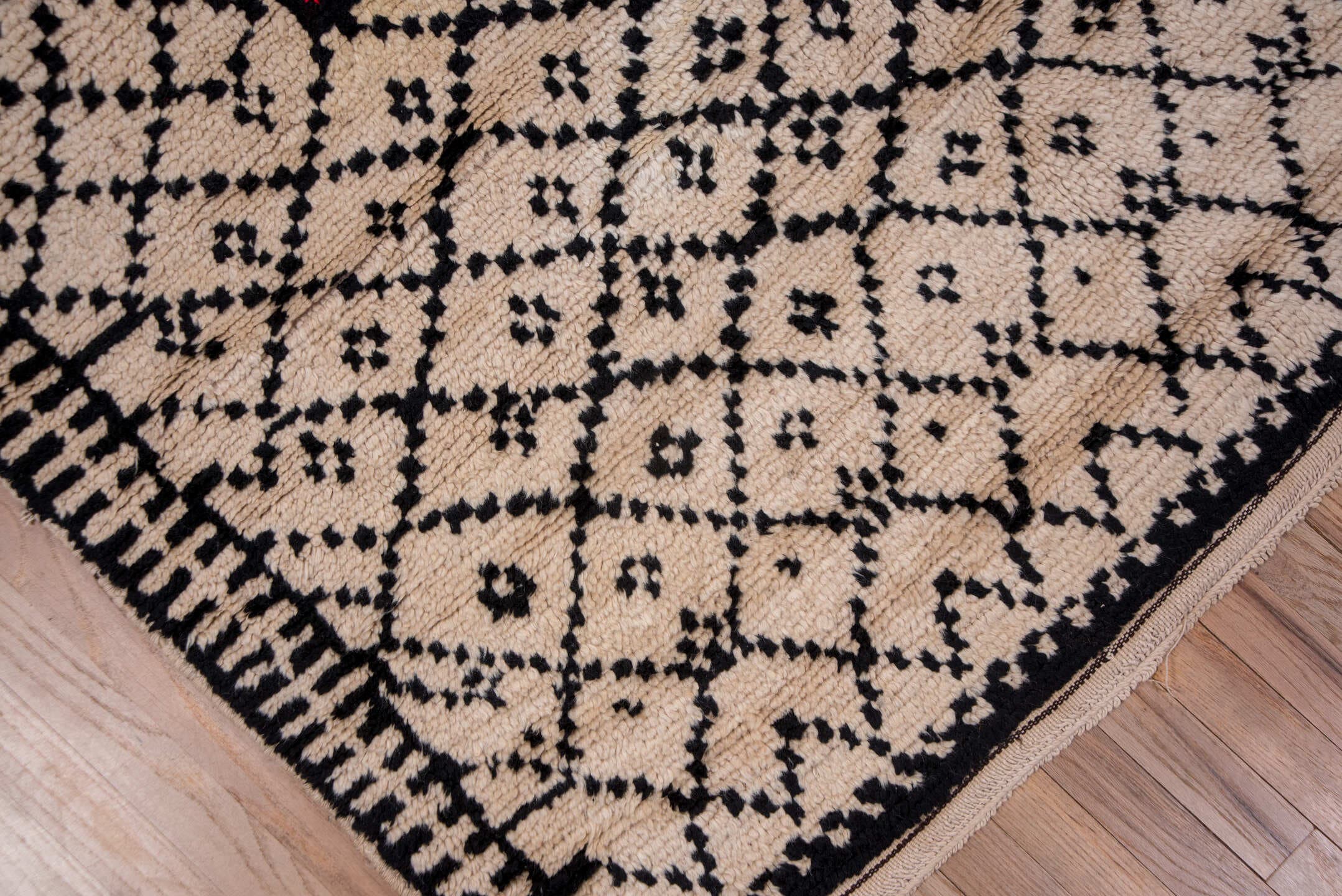 5' x 7' one-of-a-kind handmade antique Moroccan rug. Color palette: ivory, black, crimson, green, gold, rose, red, pink