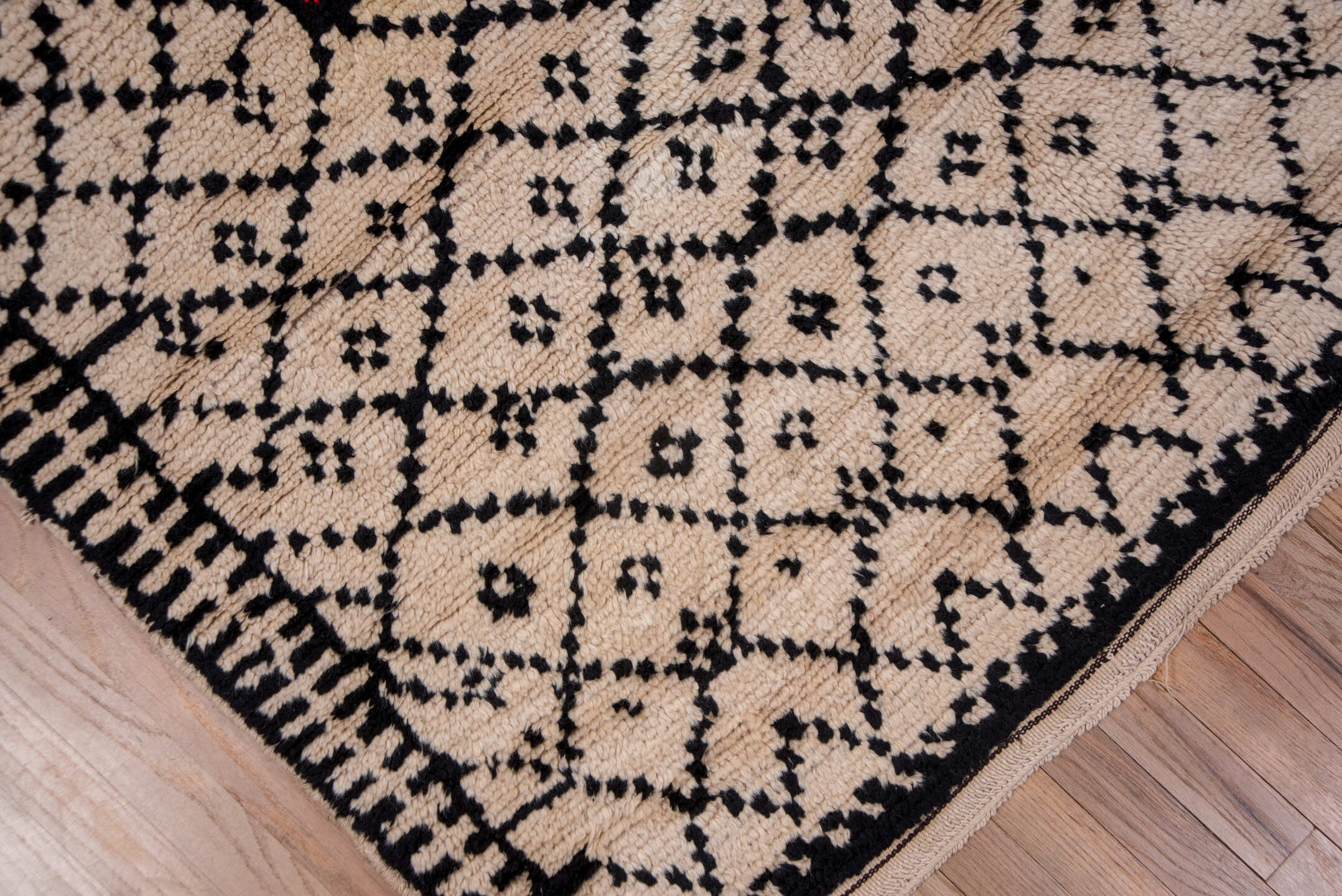 5' x 7' one-of-a-kind handmade antique Moroccan rug. Color palette: ivory, black, crimson, green, gold, rose, red, pink