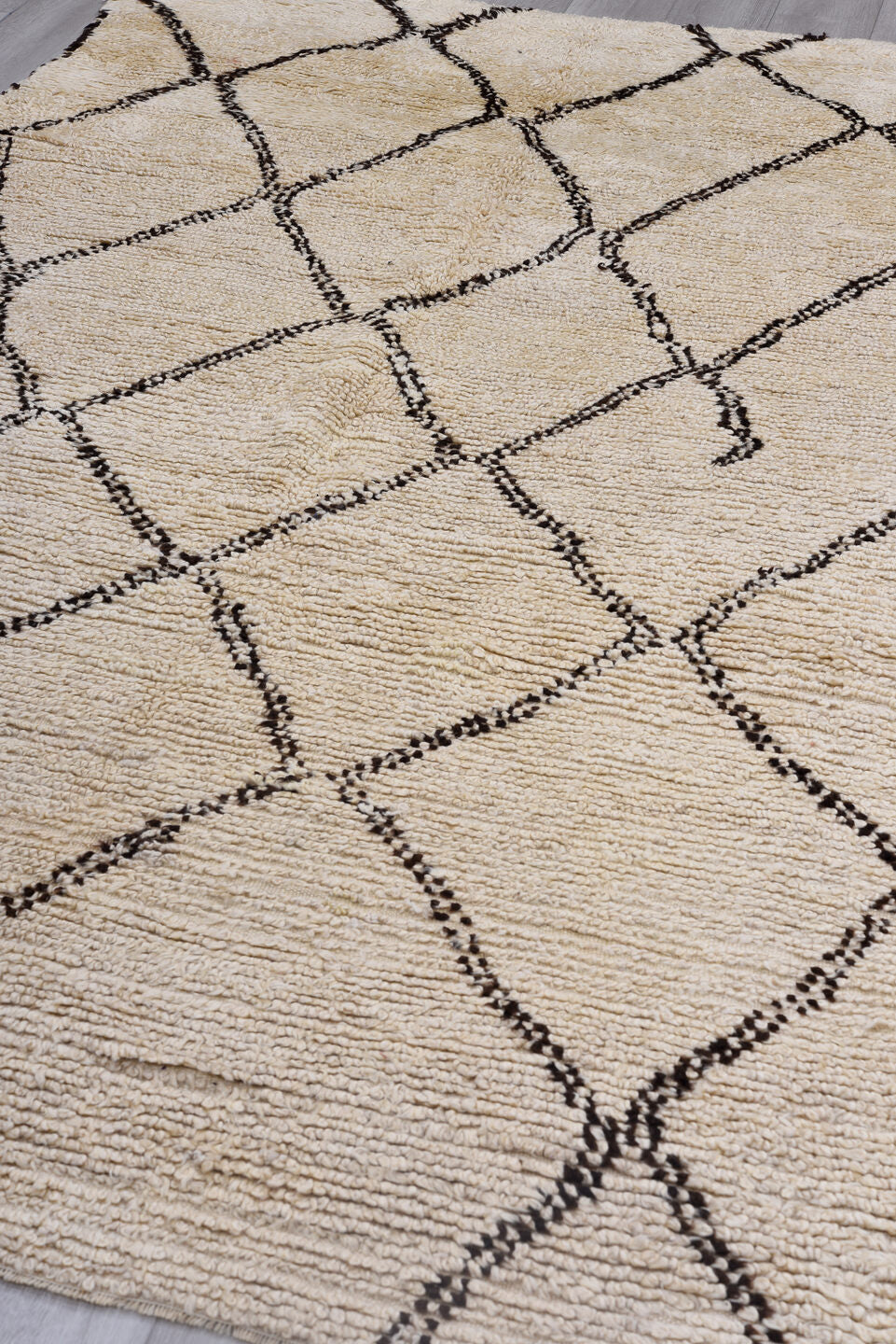 5' x 9' one-of-a-kind handmade antique Moroccan medium size rug. Color palette: ivory, brown, cream