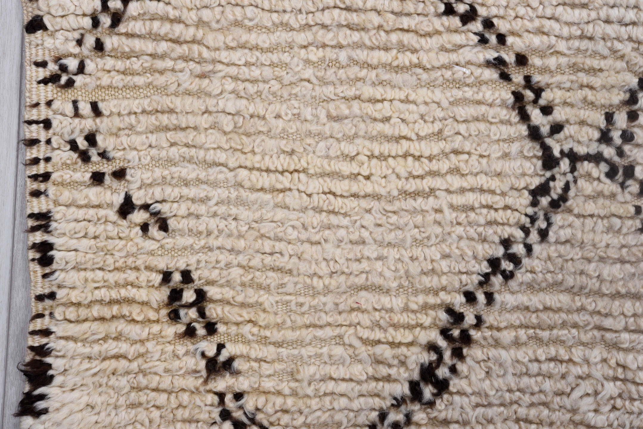 5' x 9' one-of-a-kind handmade antique Moroccan medium size rug. Color palette: ivory, brown, cream