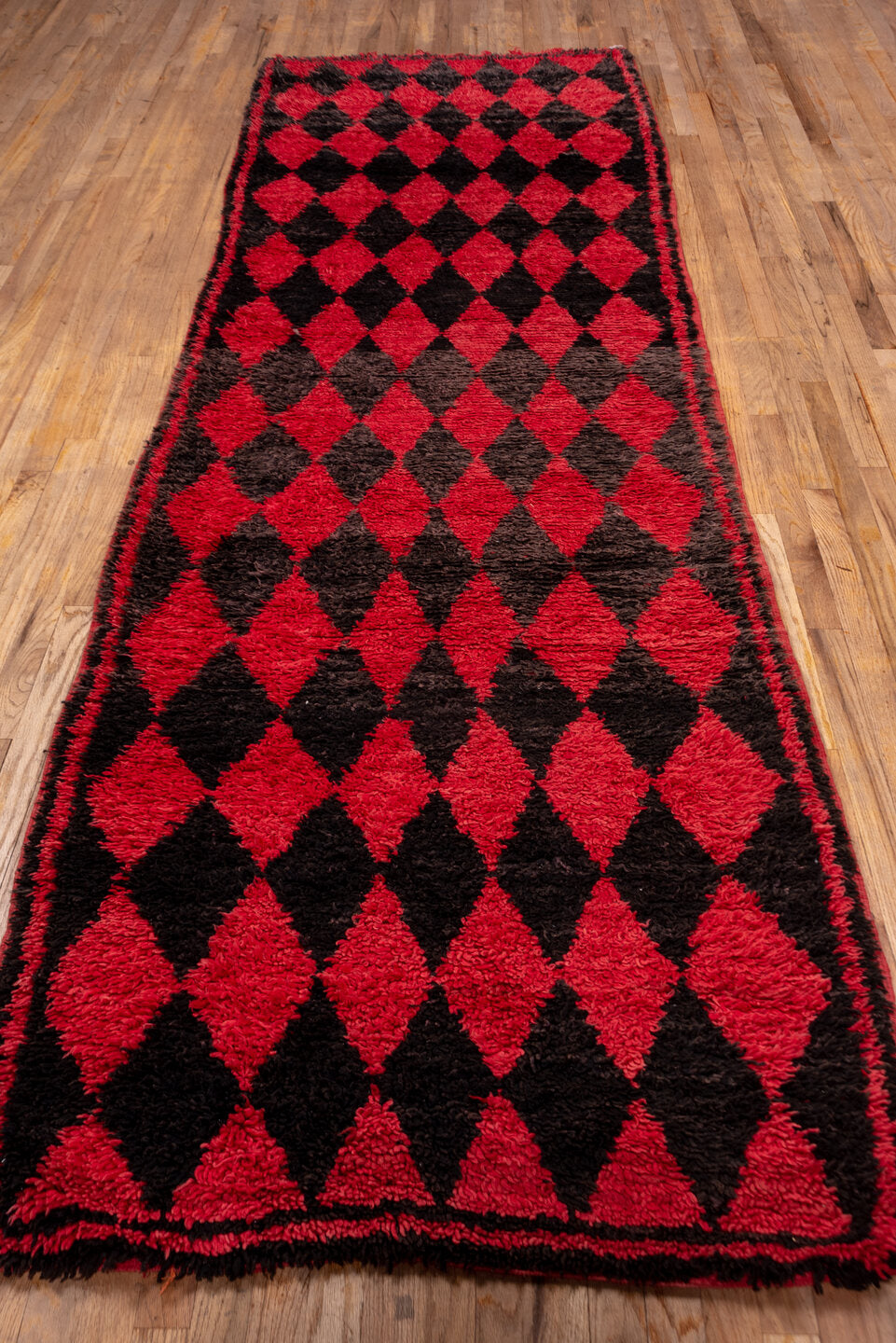 3' x 11' one-of-a-kind handmade vintage Moroccan runner rug. Color palette: crimson, charcoal, rose, red, gray, black, pink