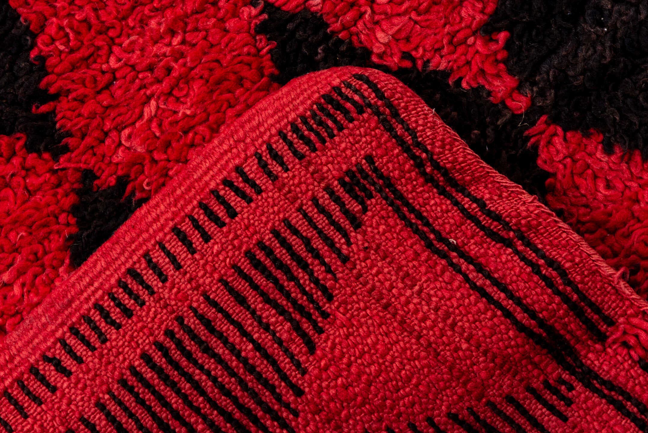 3' x 11' one-of-a-kind handmade vintage Moroccan runner rug. Color palette: crimson, charcoal, rose, red, gray, black, pink