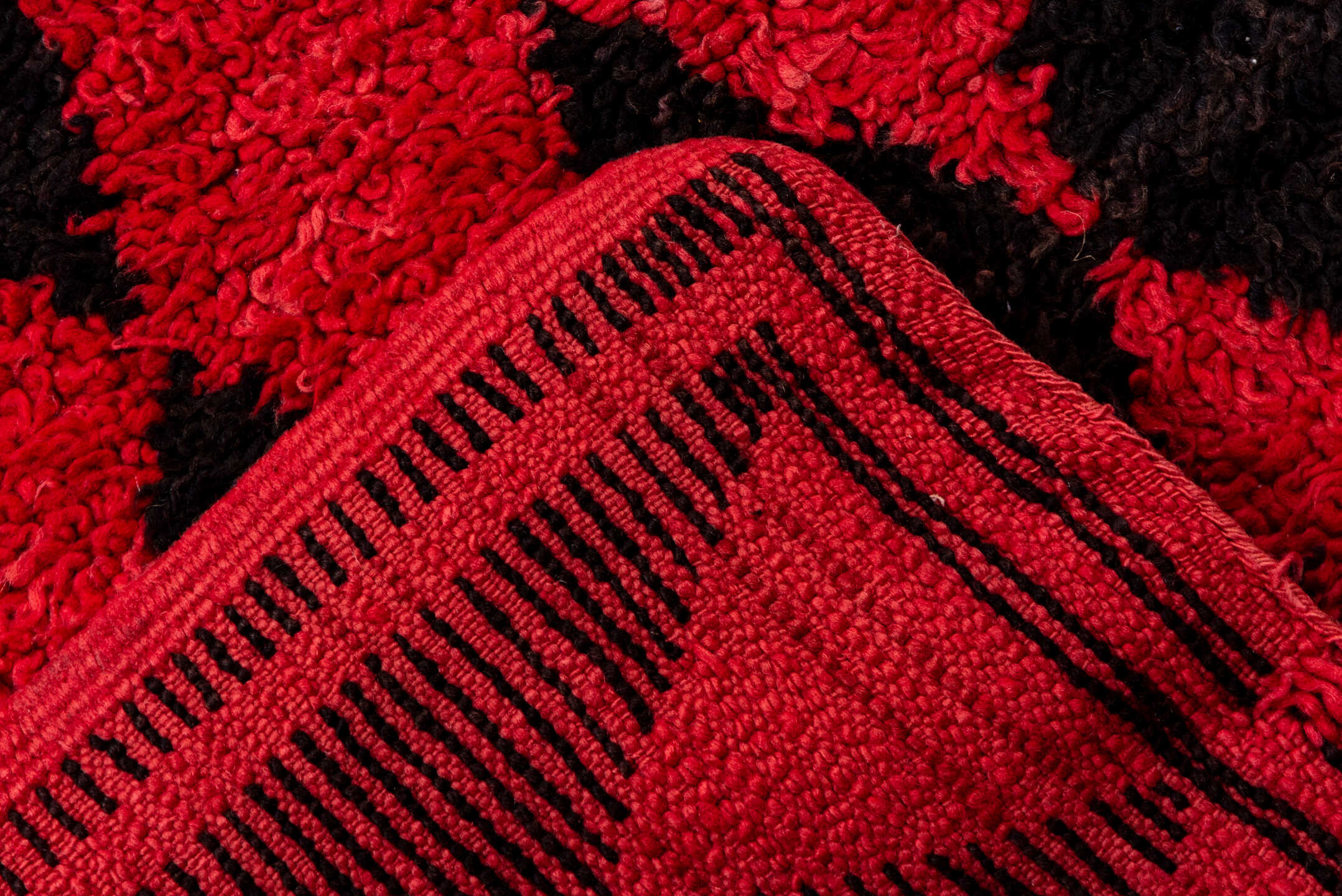 3' x 11' one-of-a-kind handmade vintage Moroccan runner rug. Color palette: crimson, charcoal, rose, red, gray, black, pink