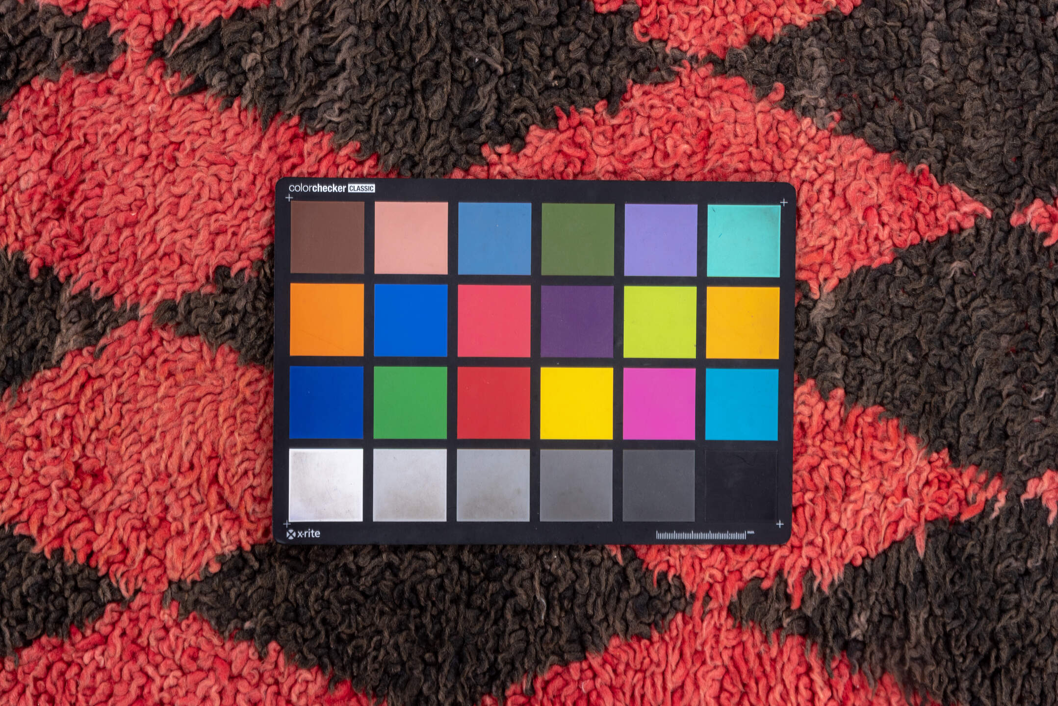 3' x 11' one-of-a-kind handmade vintage Moroccan runner rug. Color palette: black, brown, gray, indian red, pink, red