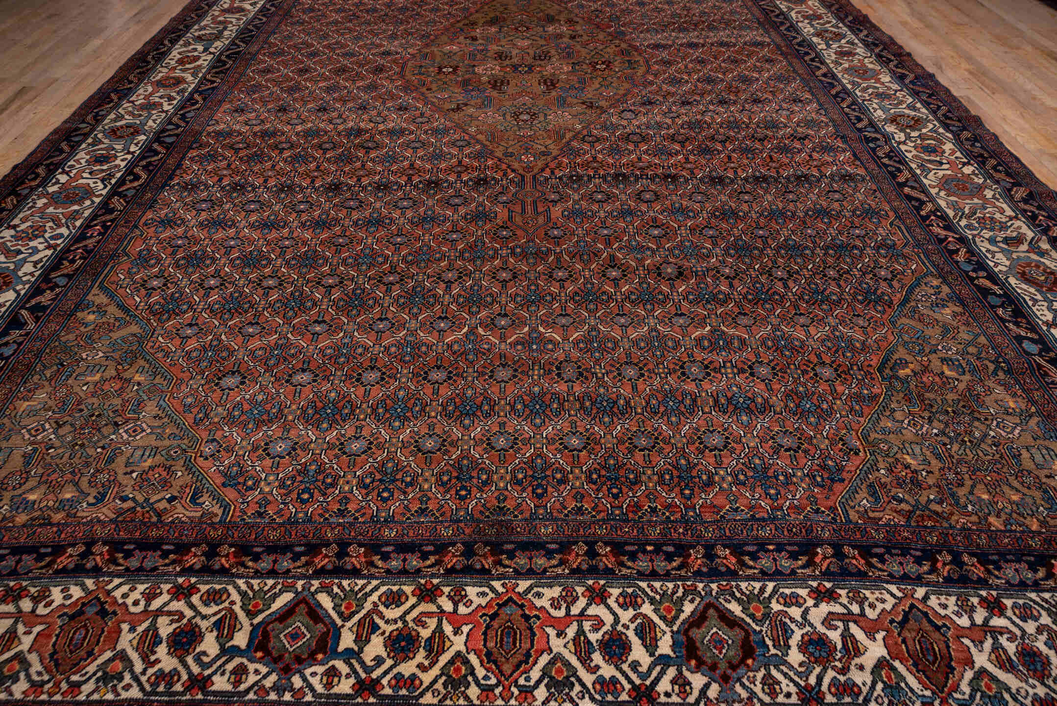 12' x 21' one-of-a-kind handmade antique Bibikabad oversize rug. Color palette: rust, navy, ivory, camel, terra cotta, slate