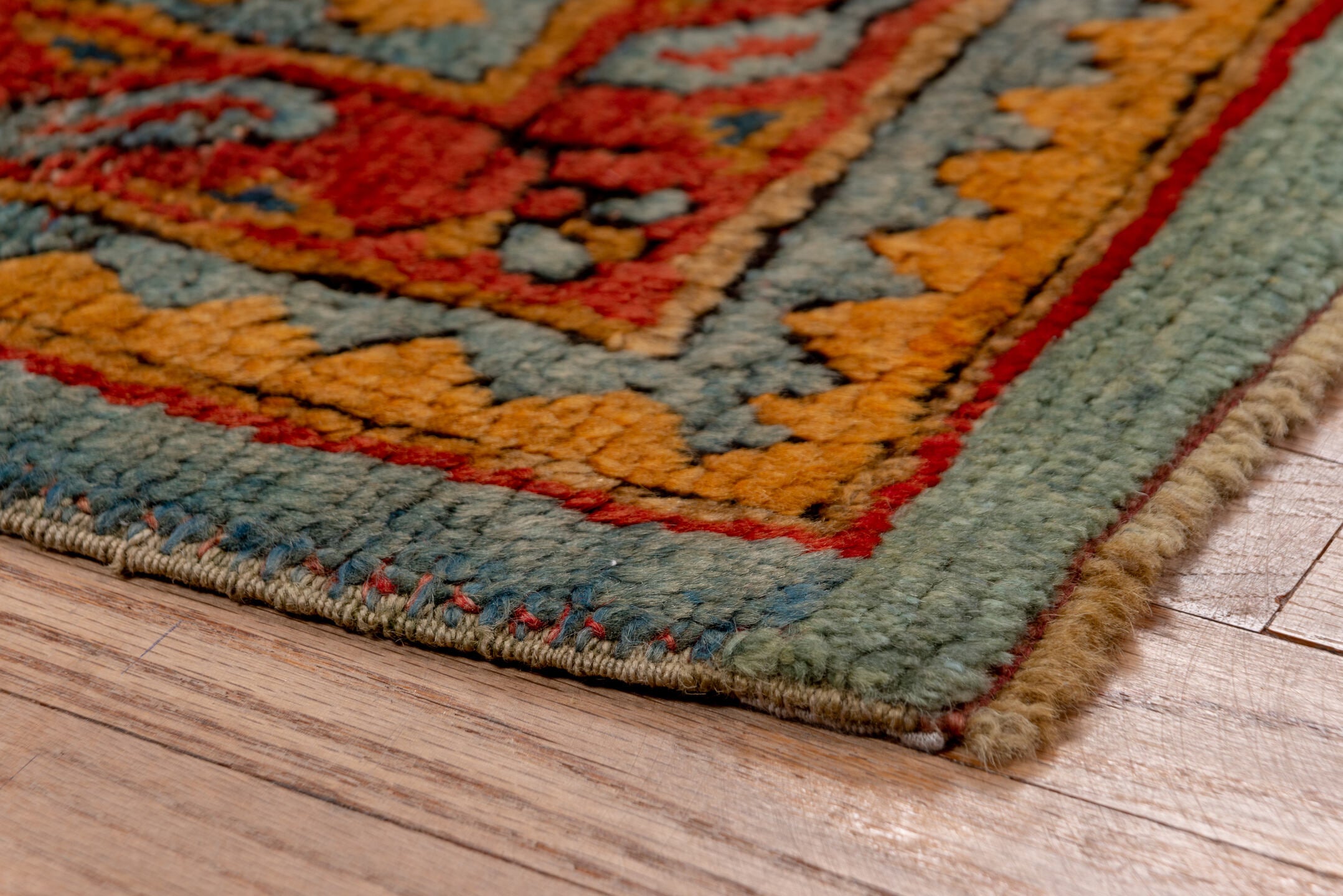 7' x 8' one-of-a-kind handmade antique Oushak rug. Color palette: rust, blue, gold, ivory, slate, terra cotta, charcoal