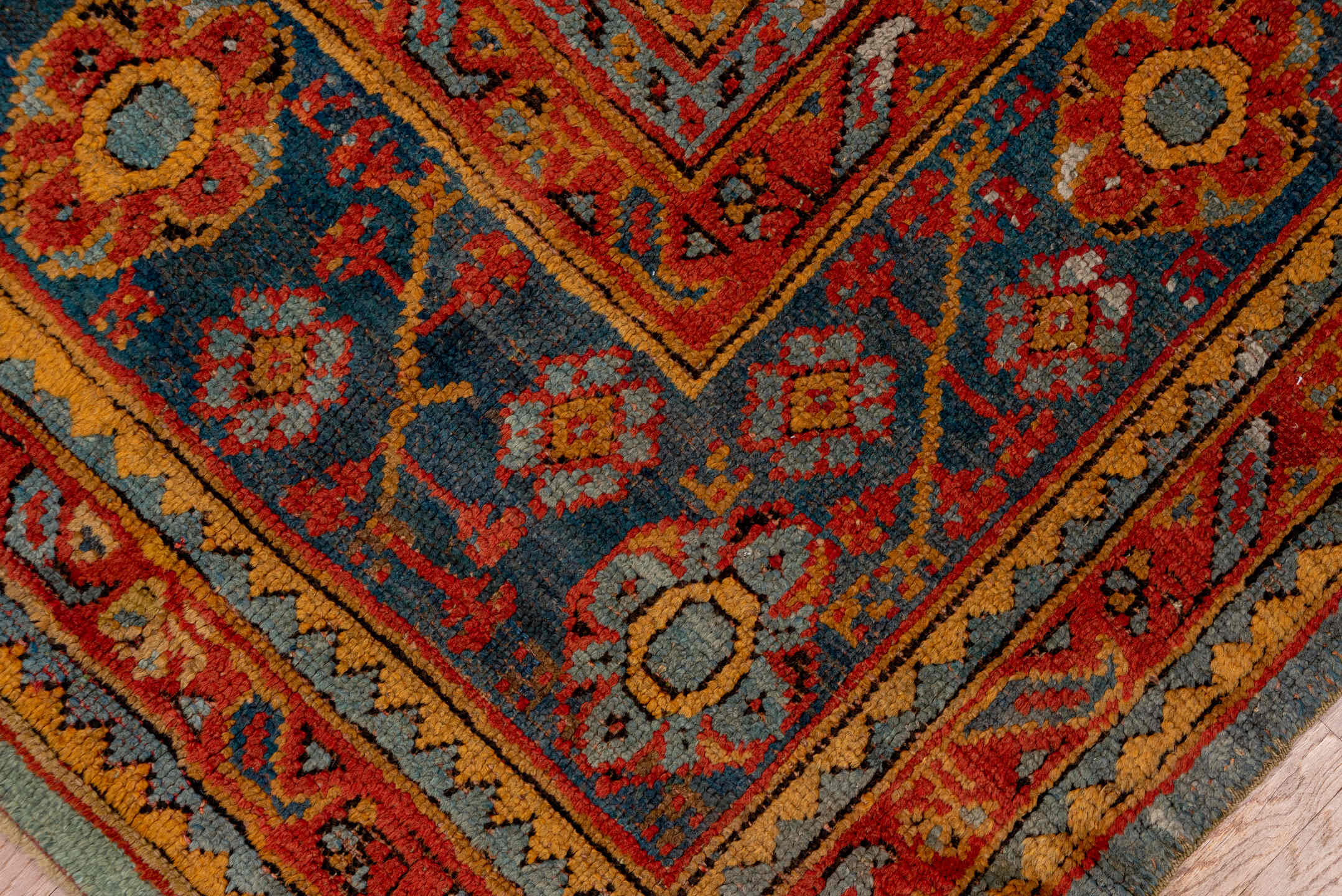 7' x 8' one-of-a-kind handmade antique Oushak rug. Color palette: rust, blue, gold, ivory, slate, terra cotta, charcoal