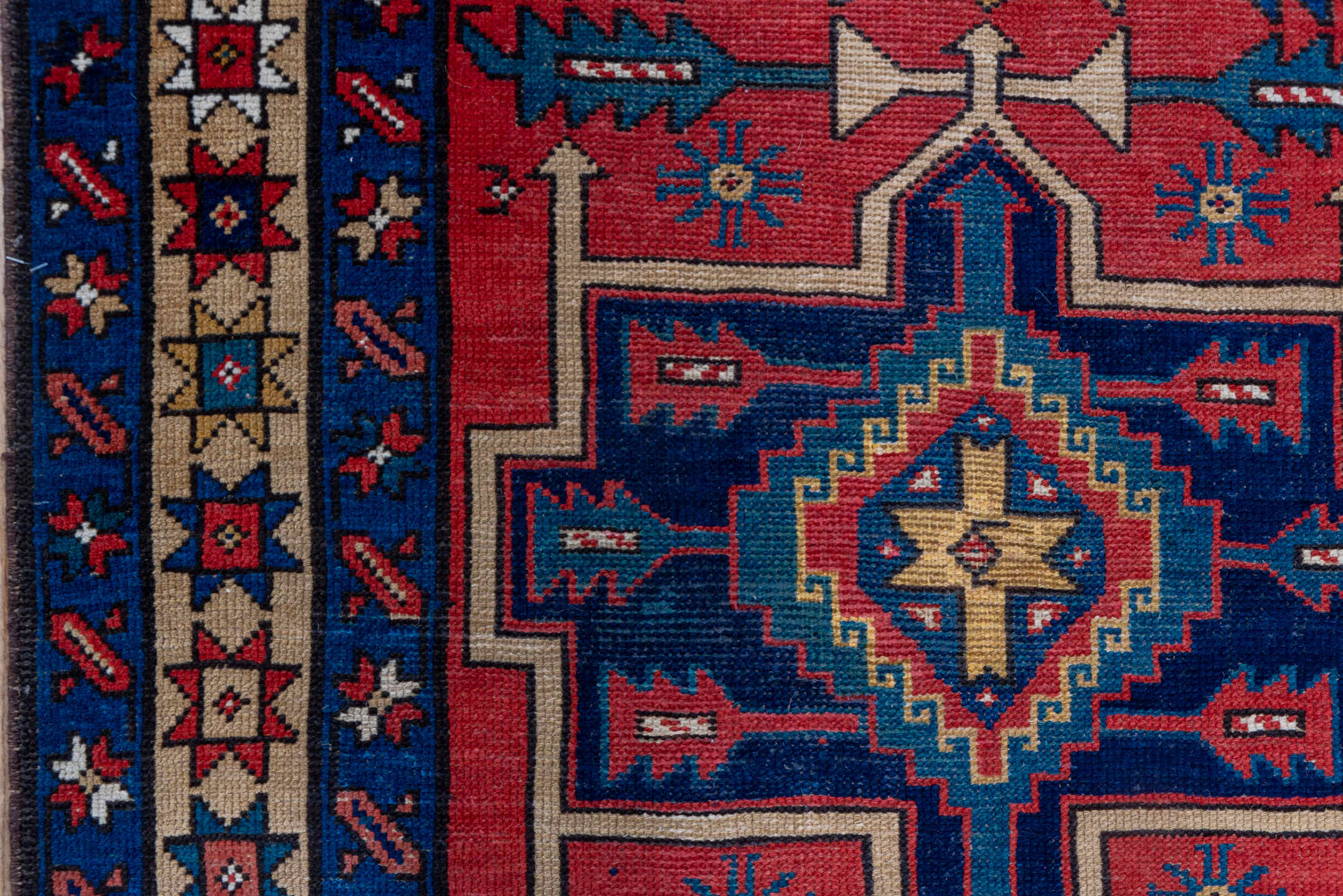 3' x 10' one-of-a-kind handmade antique Heriz runner rug. Color palette: red, navy, ivory, camel, rust, charcoal, blue