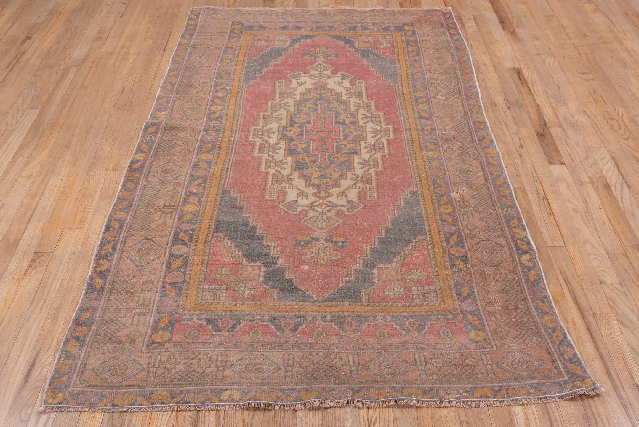 4' x 7' one-of-a-kind handmade antique Oushak rug. Color palette: rose, taupe, slate, ivory, gold, terra cotta, dusty blue