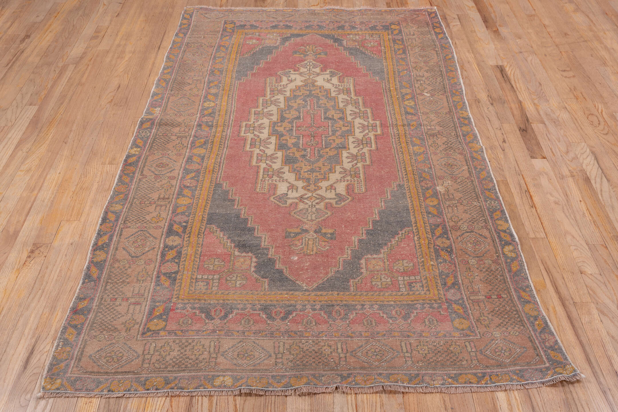 4' x 7' one-of-a-kind handmade antique Oushak rug. Color palette: rose, taupe, slate, ivory, gold, terra cotta, dusty blue