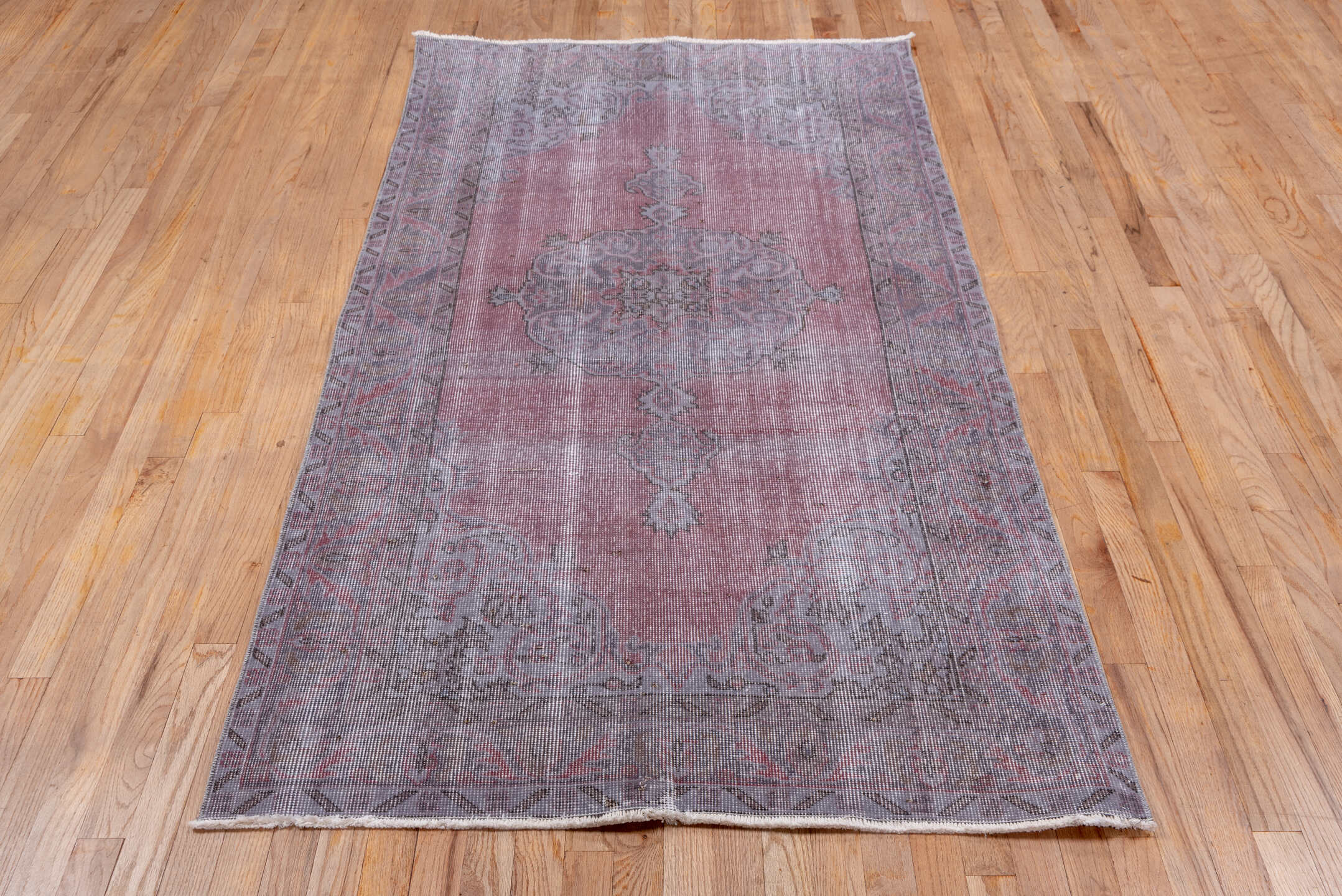 3' x 7' one-of-a-kind handmade vintage Overdyed rug. Color palette: dark gray, gray, light gray, off-white, pink